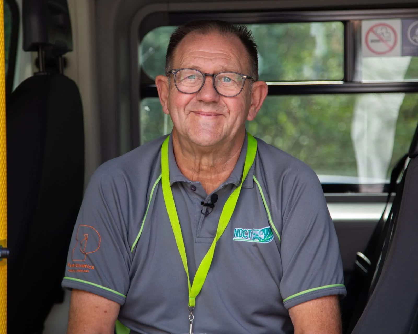 Volunteer driver sitting in a community transport minibus