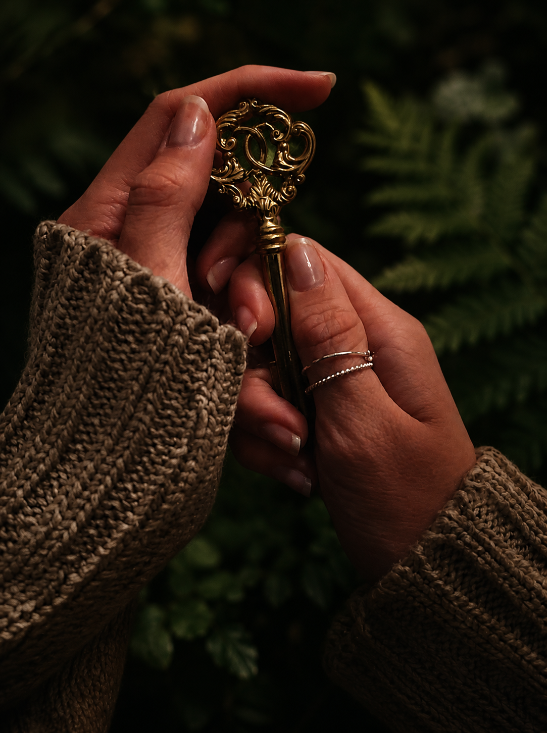 Vintage gold key held in hand, symbolizing spiritual initiation, transformation, and unlocking the next chapter of healing.