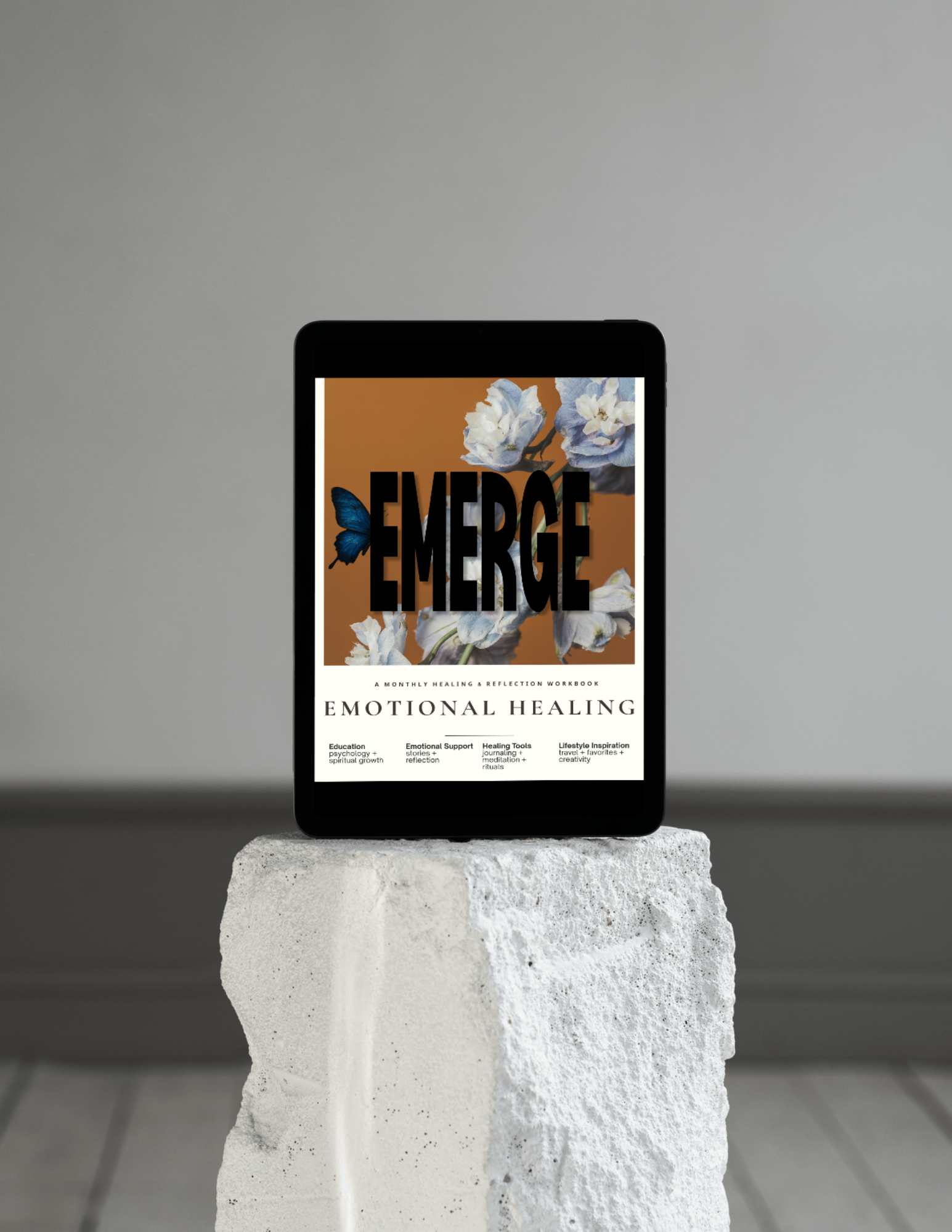 Emerge: Emotional Healing digital magazine on a tablet, a monthly healing resource for women recovering from toxic relationships and emotional exhaustion.