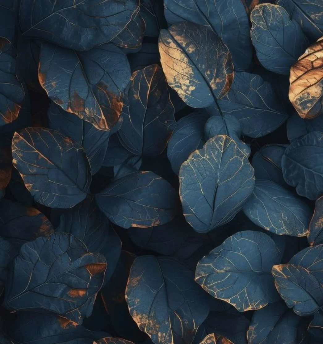 Dark blue leaves with golden veins and weathered edges, symbolizing emotional resilience, transformation, and beauty after survival.