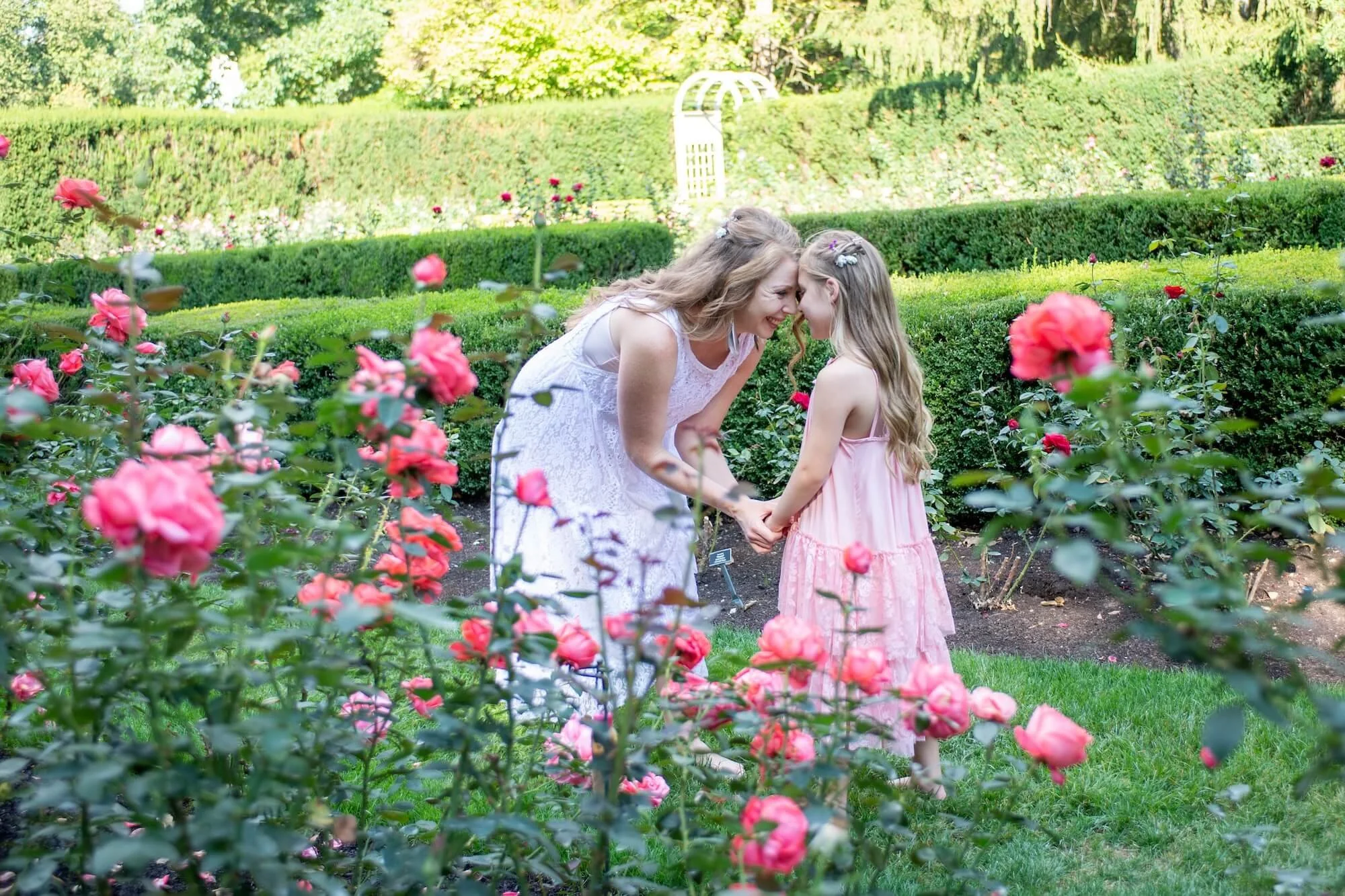 Briana with daughter Evelyn in a garden