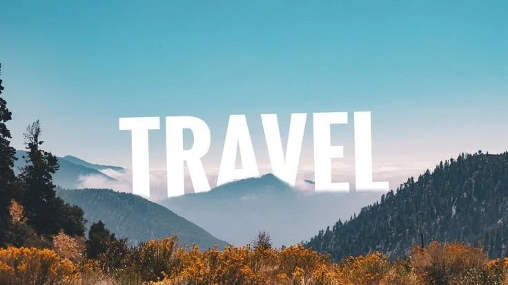 A scenic mountain landscape with the word 'TRAVEL' in large white letters overlaying the image.