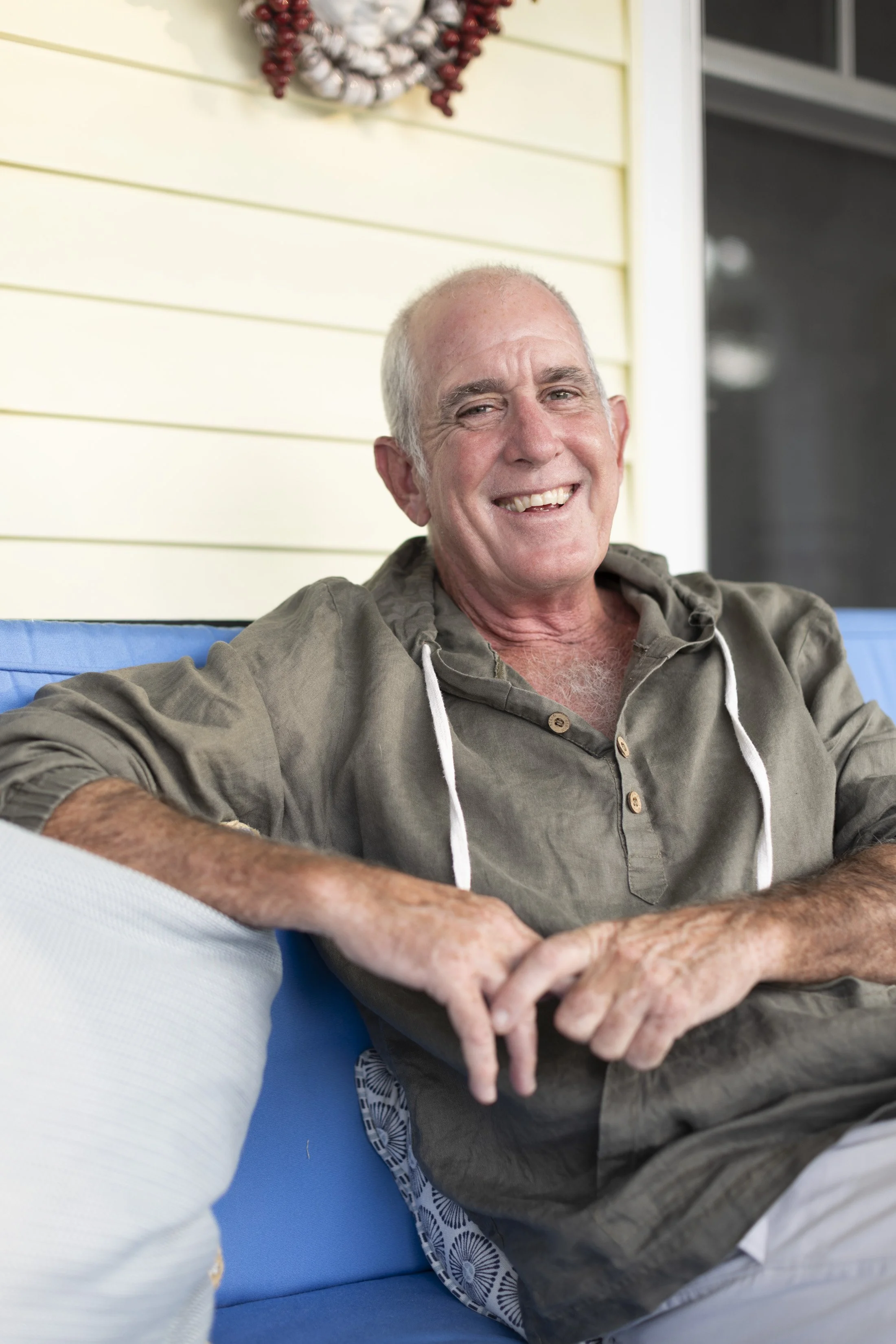 Artist Charles Thomas O'Neil relaxing on the porch at Fishers Island.