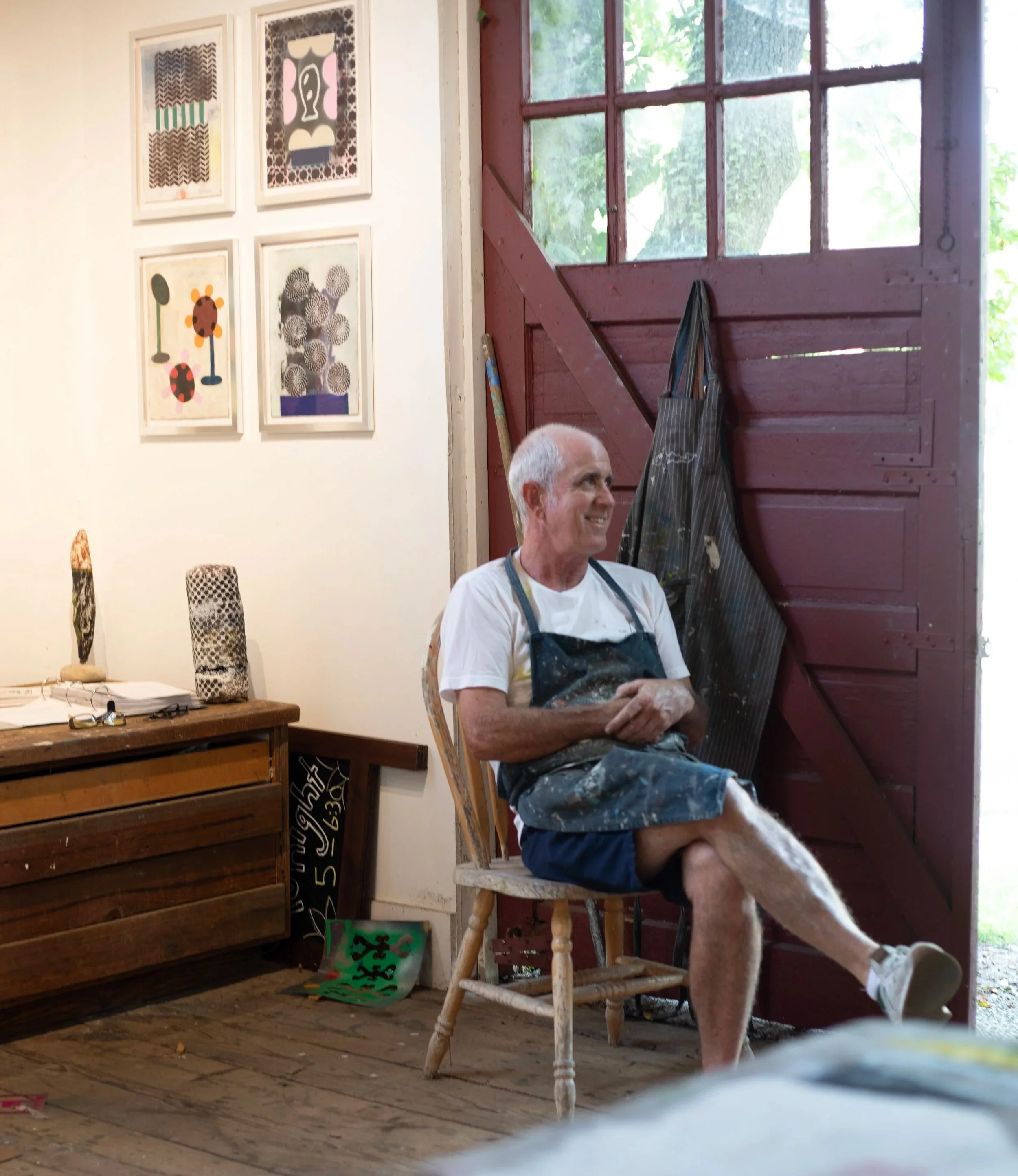 Charles Thomas O'Neil sitting in the Red Barn Gallery, Fishers Island, NY.
