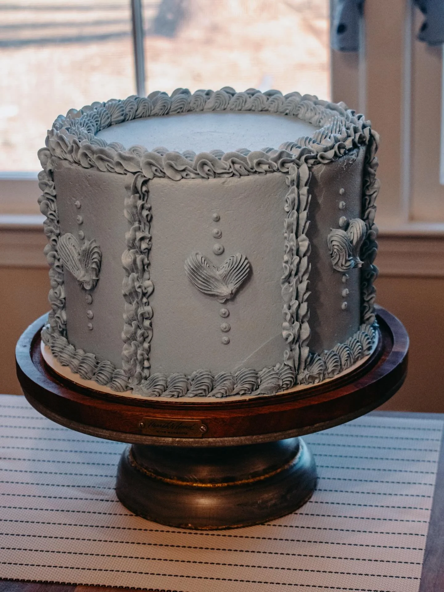 An elegant and beautiful carrot cake for the sweetest baby sprinkle! 6 layers of carrot cake filled with a maple buttercream and candied pecans! All gluten and dairy free! It&rsquo;s such a treat to use my gift for friends and it was such a treat to 