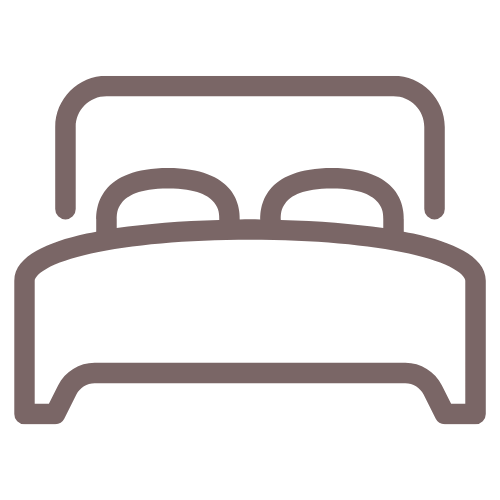 Simple line drawing of a bed with pillows.