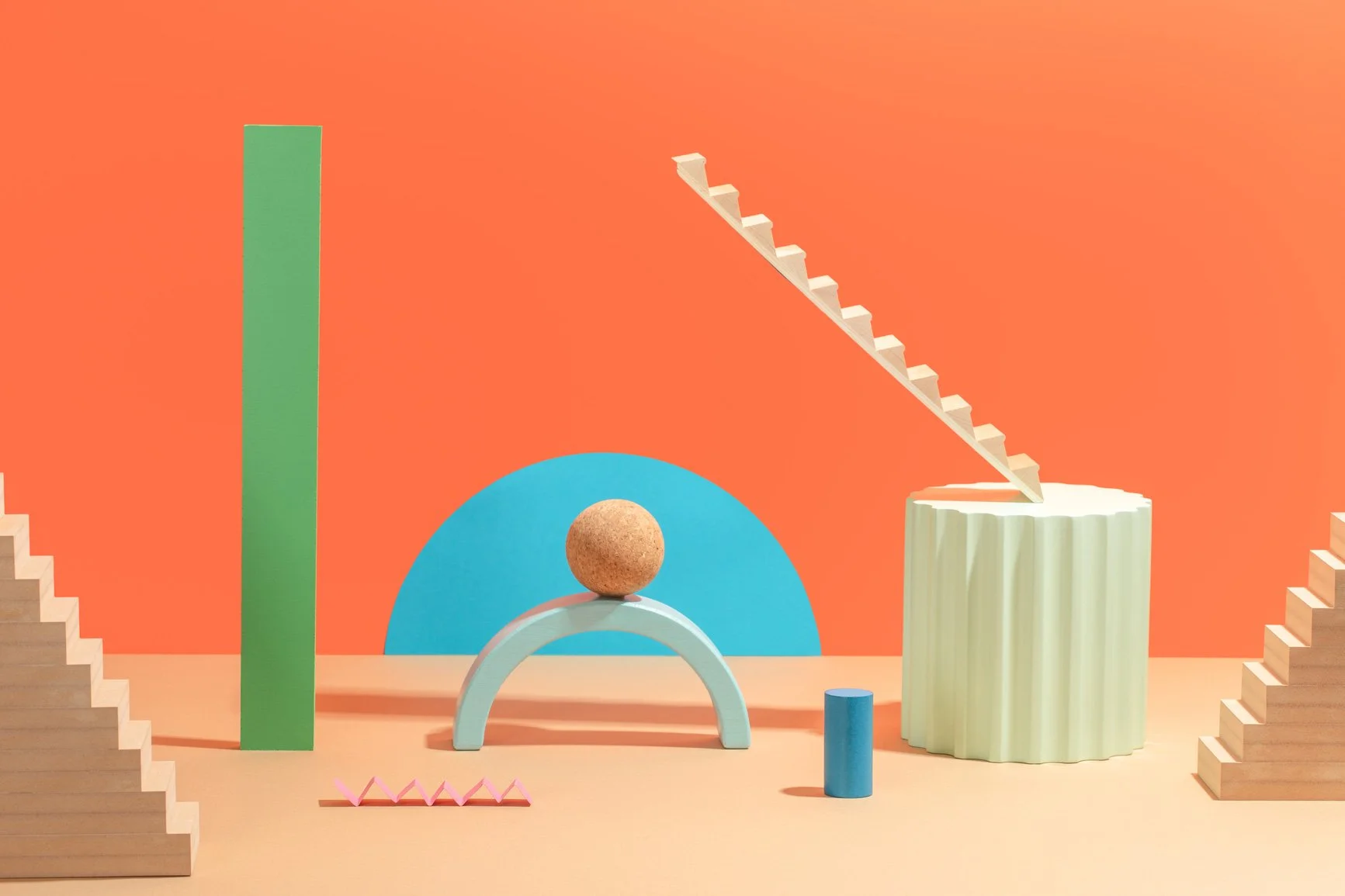 stairs and coloured shapes on orange background