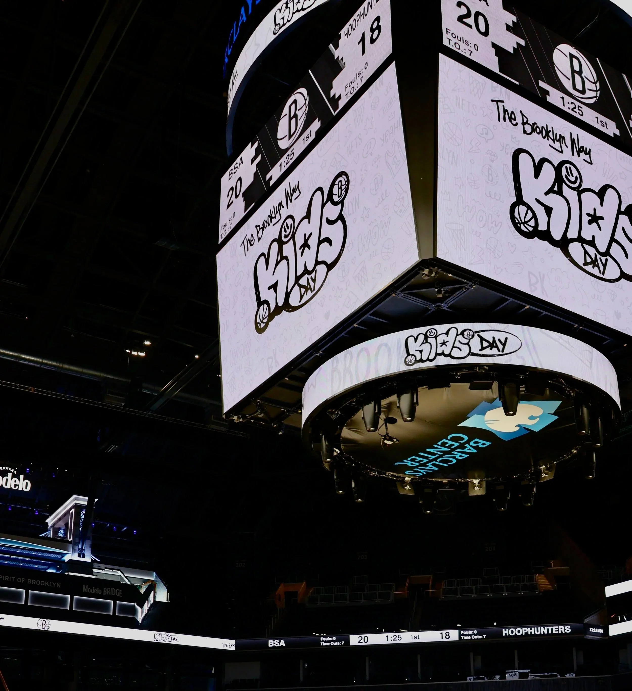 Large digital scoreboard in a basketball arena displaying Brooklyn Nets' Kids Day event and game details.