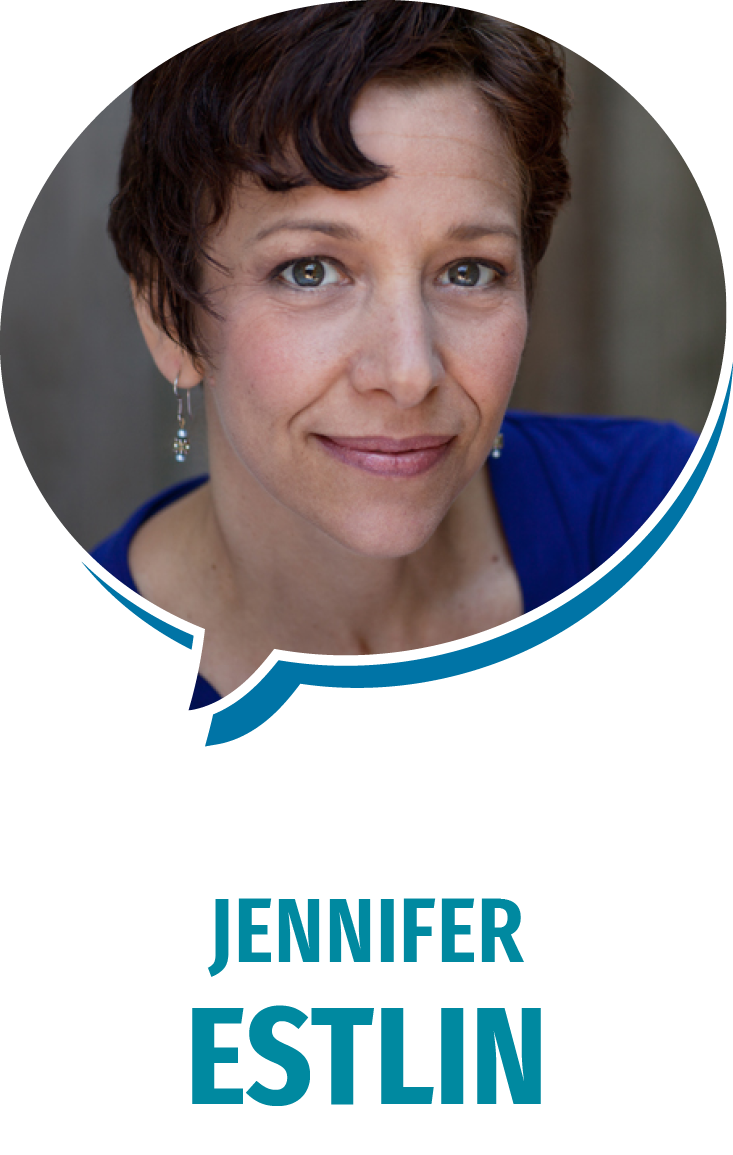 Close-up portrait of a woman with short, dark hair, wearing a blue top and dangling earrings, smiling softly.