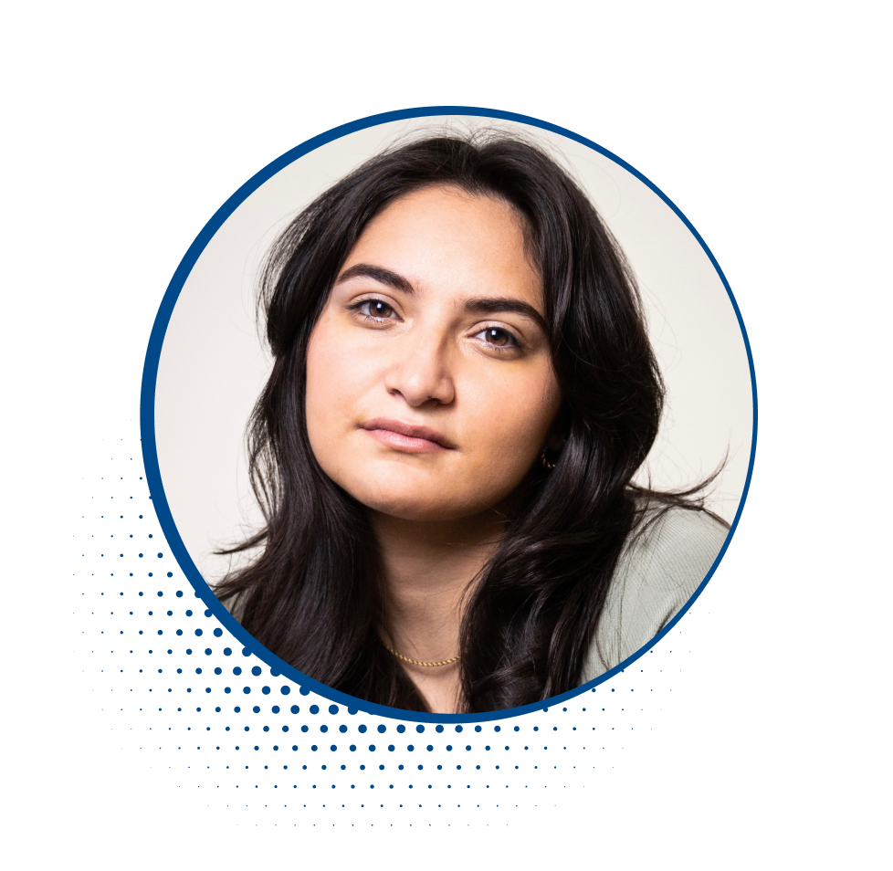 Close-up photo of a young woman with long dark hair and a neutral expression.