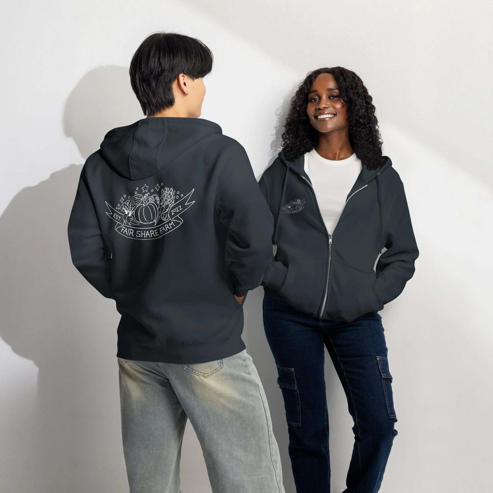 Fair Share Farm zip up hoodie in black modeled by man and woman