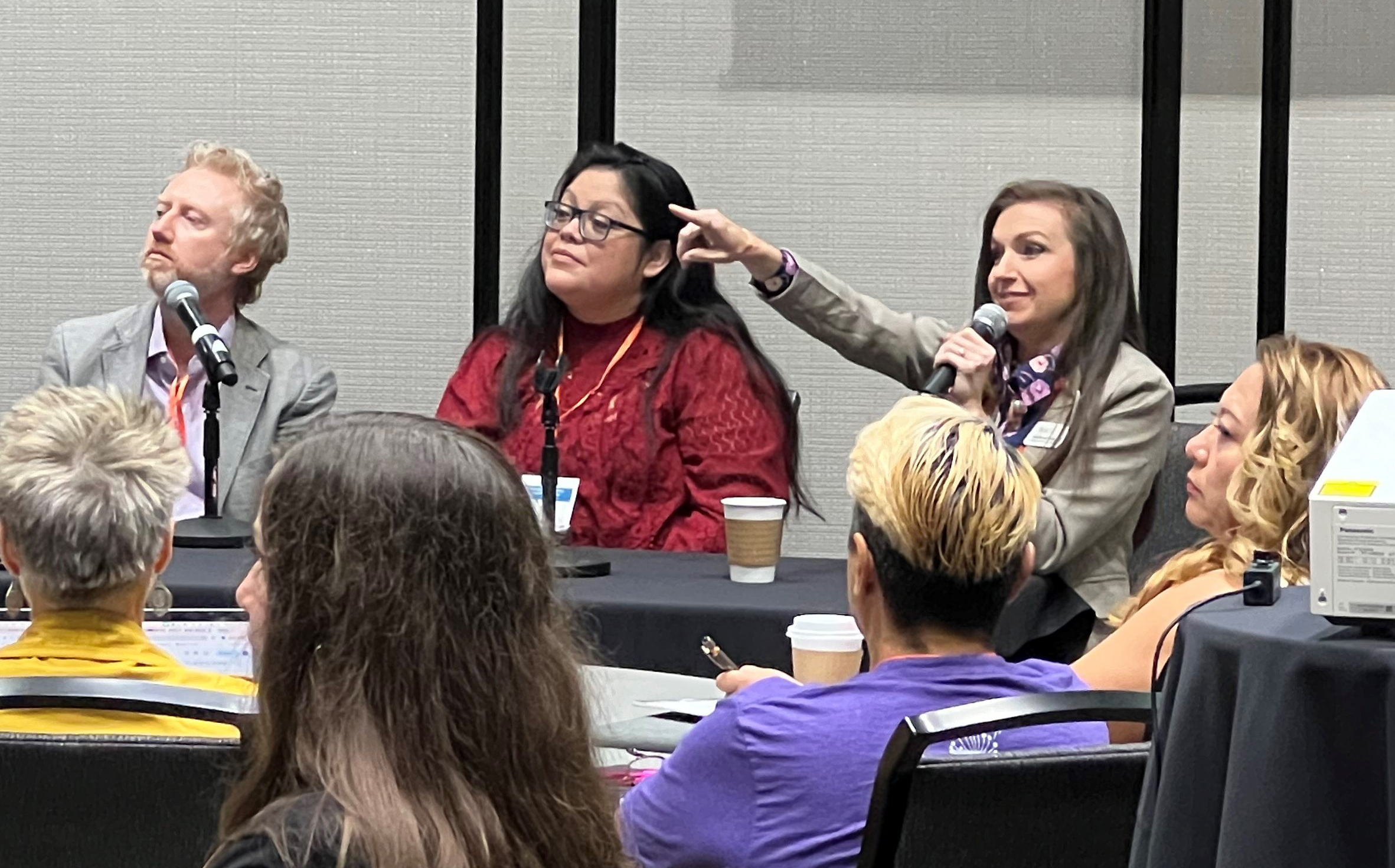 Group of conference attendees sitting in a presentation