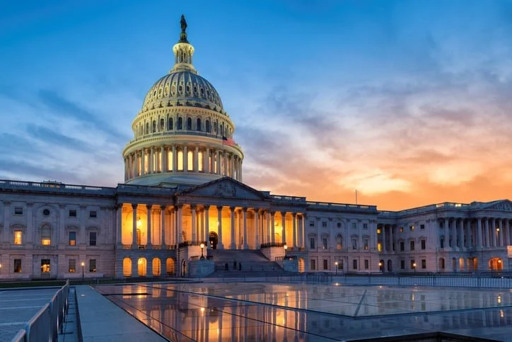 U.S. Capitol dome seen against the sky at sunset