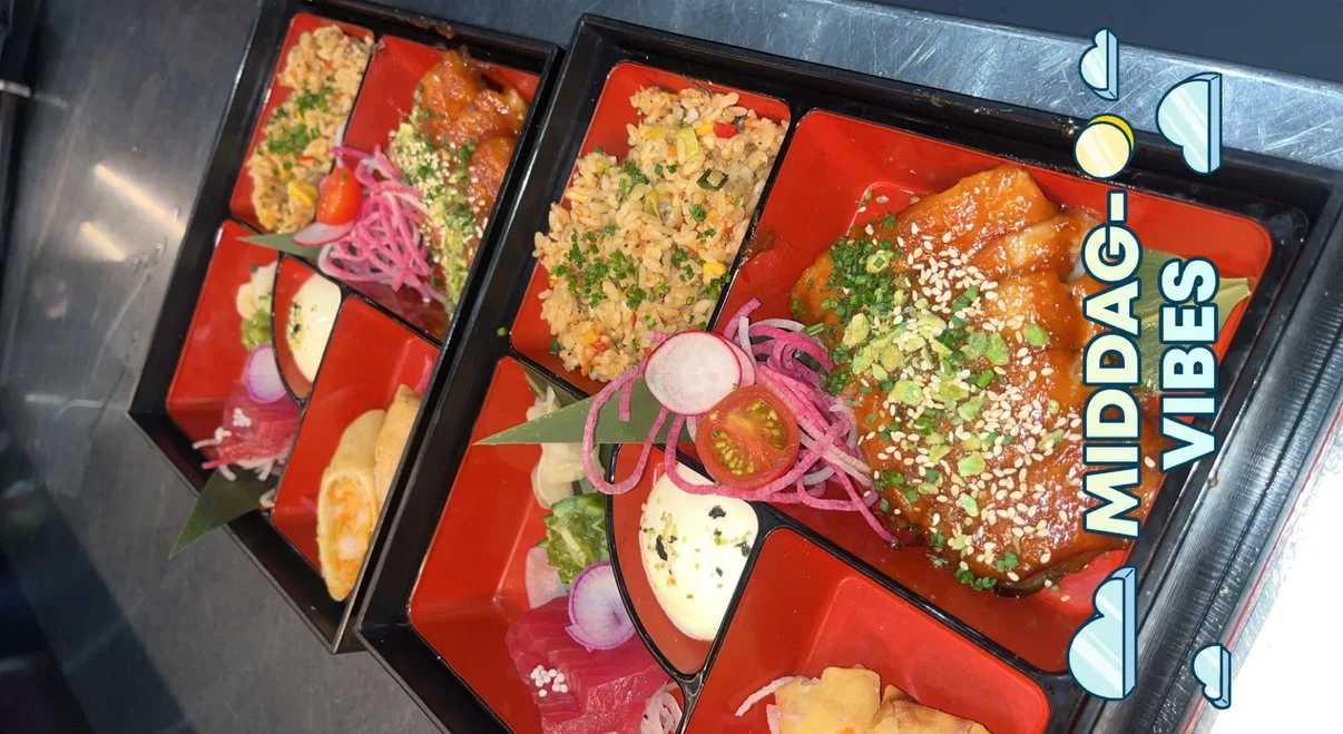 Three Japanese bento boxes with rice, vegetables, and protein dishes, decorated with pickled vegetables and garnishes, displaying vibrant colors and an origami-style label that reads 'MIDDAY-G VIBES'.