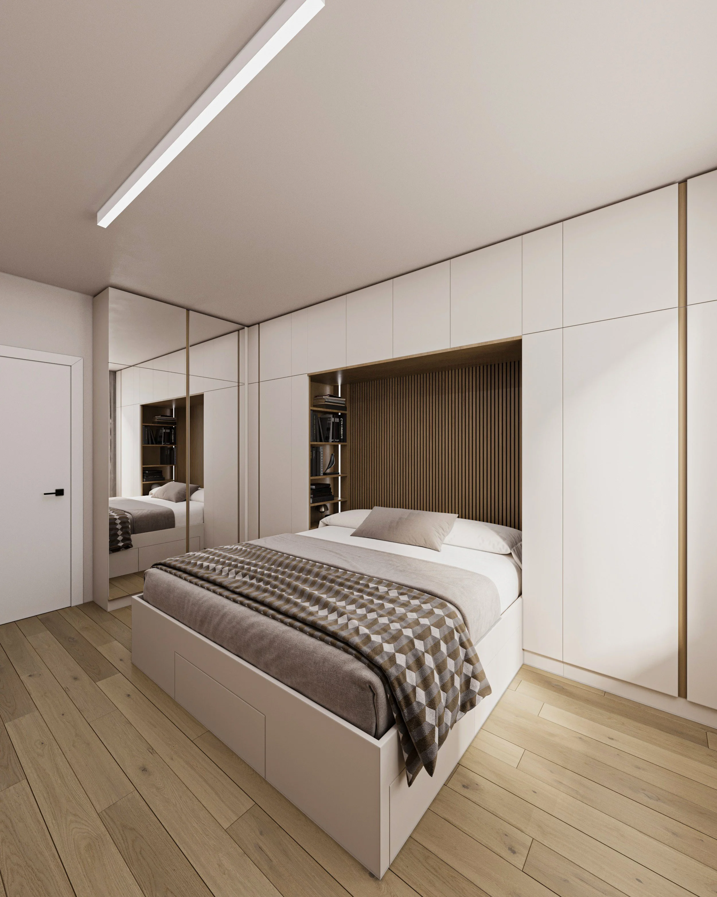 Modern bedroom with a white bed, beige bedding, and a wooden headboard with built-in bookshelves, mirrored closet doors, and light wood flooring.