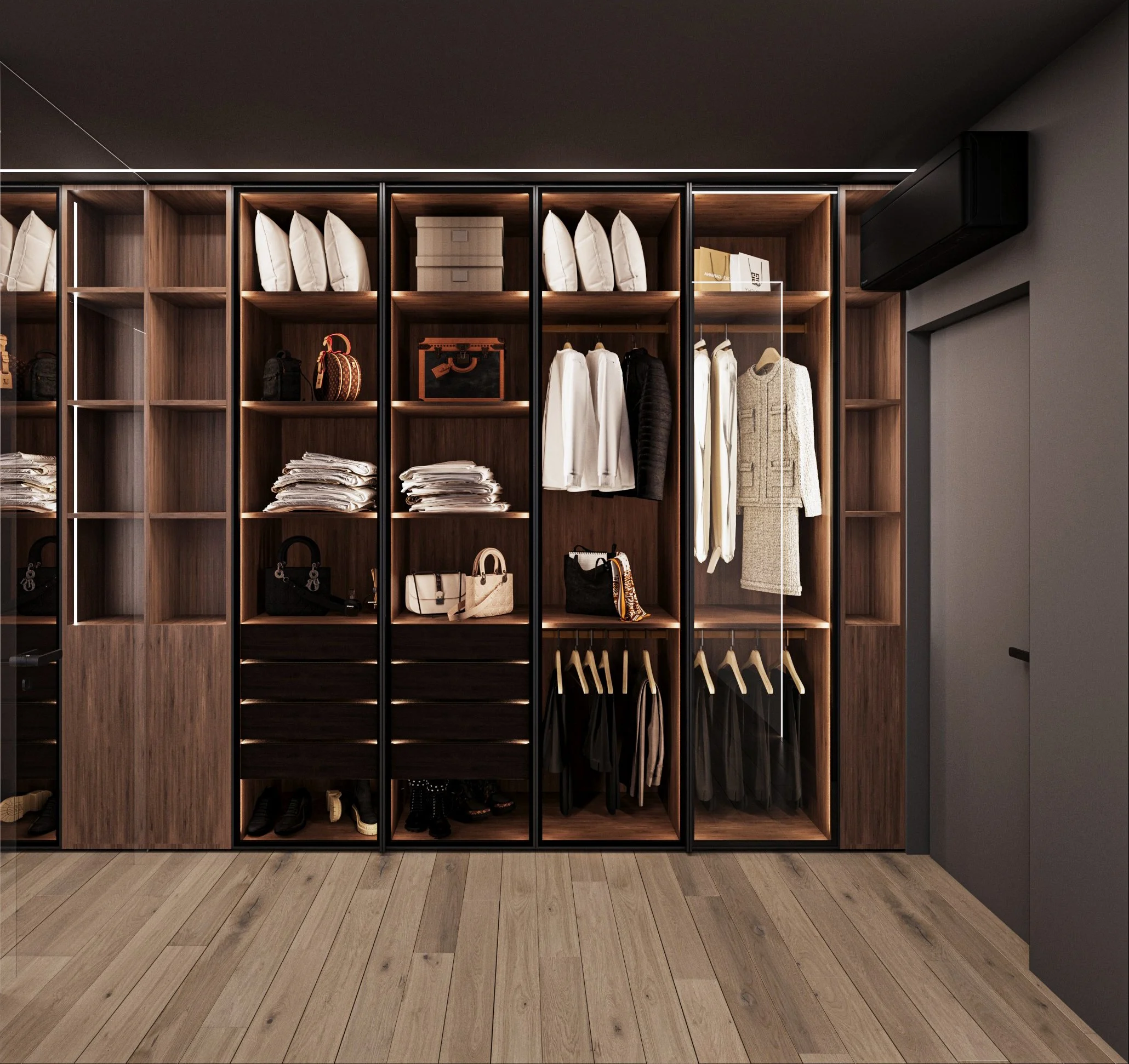 Modern walk-in closet with wooden shelves containing handbags, folded clothes, and shoes. Clothes are hung on hangers, and accessories are neatly arranged.