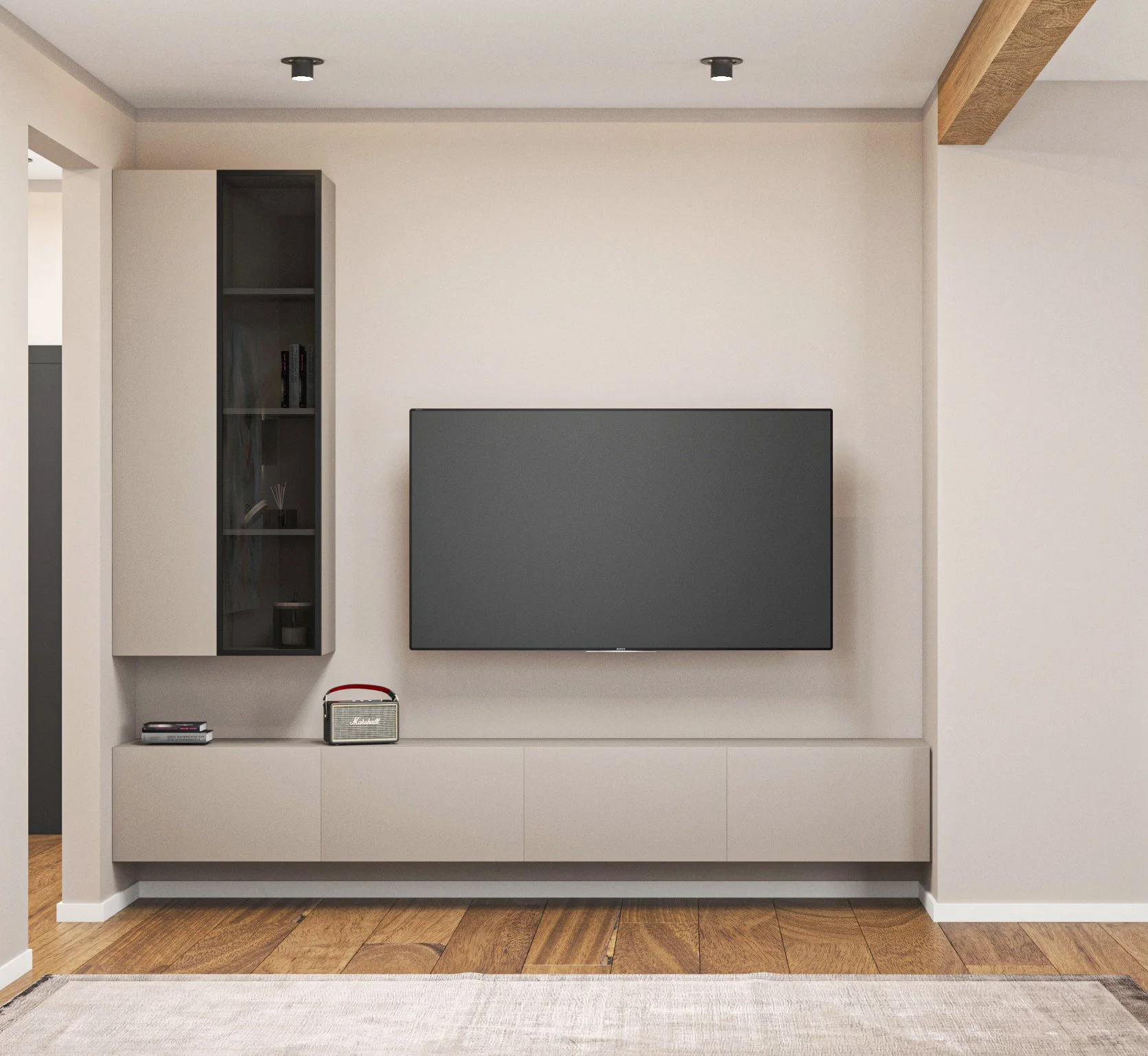 Living room with a mounted flat-screen TV, a grey wall-mounted cabinet with glass door on the left, a small Marshall speaker and some books on a low shelf below, and wooden flooring with a beige rug.
