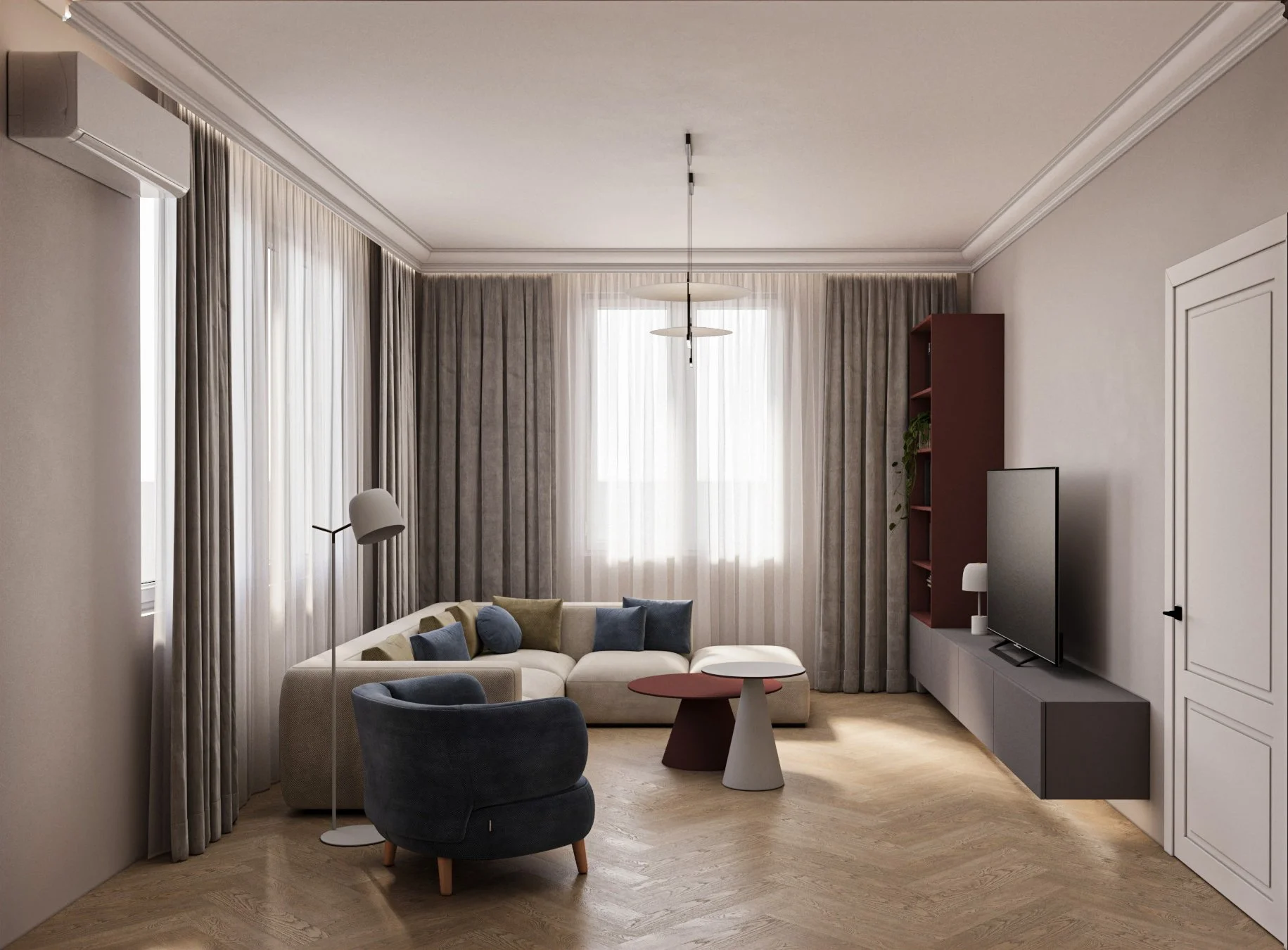 Modern living room with beige sectional sofa, dark blue armchair, gray coffee table, TV on gray media console, tall bookshelf, window with sheer white curtains, beige walls, wooden floor, ceiling light, and floor lamp.