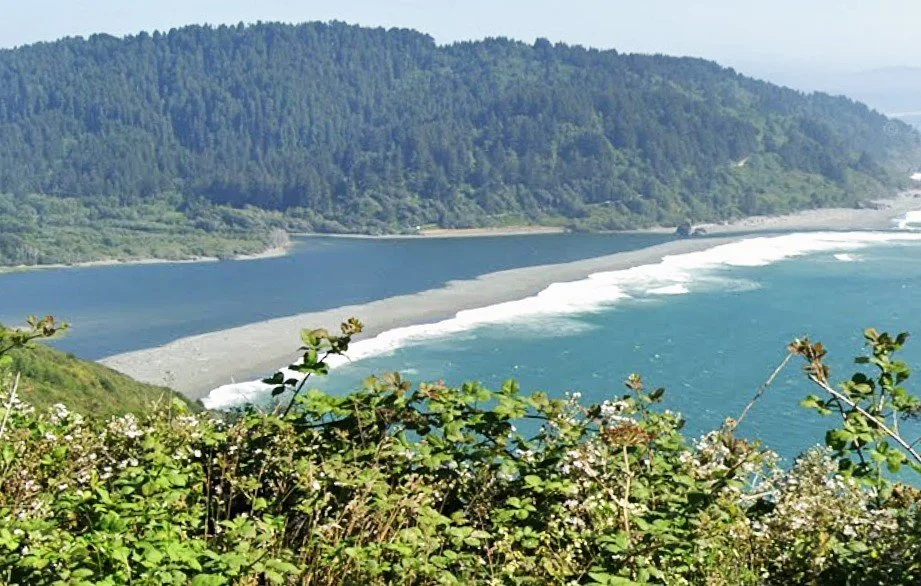 N. Coast CA travel blog - the darker blue of the Klamath River empties into the Pacific Ocean's aqua blue
