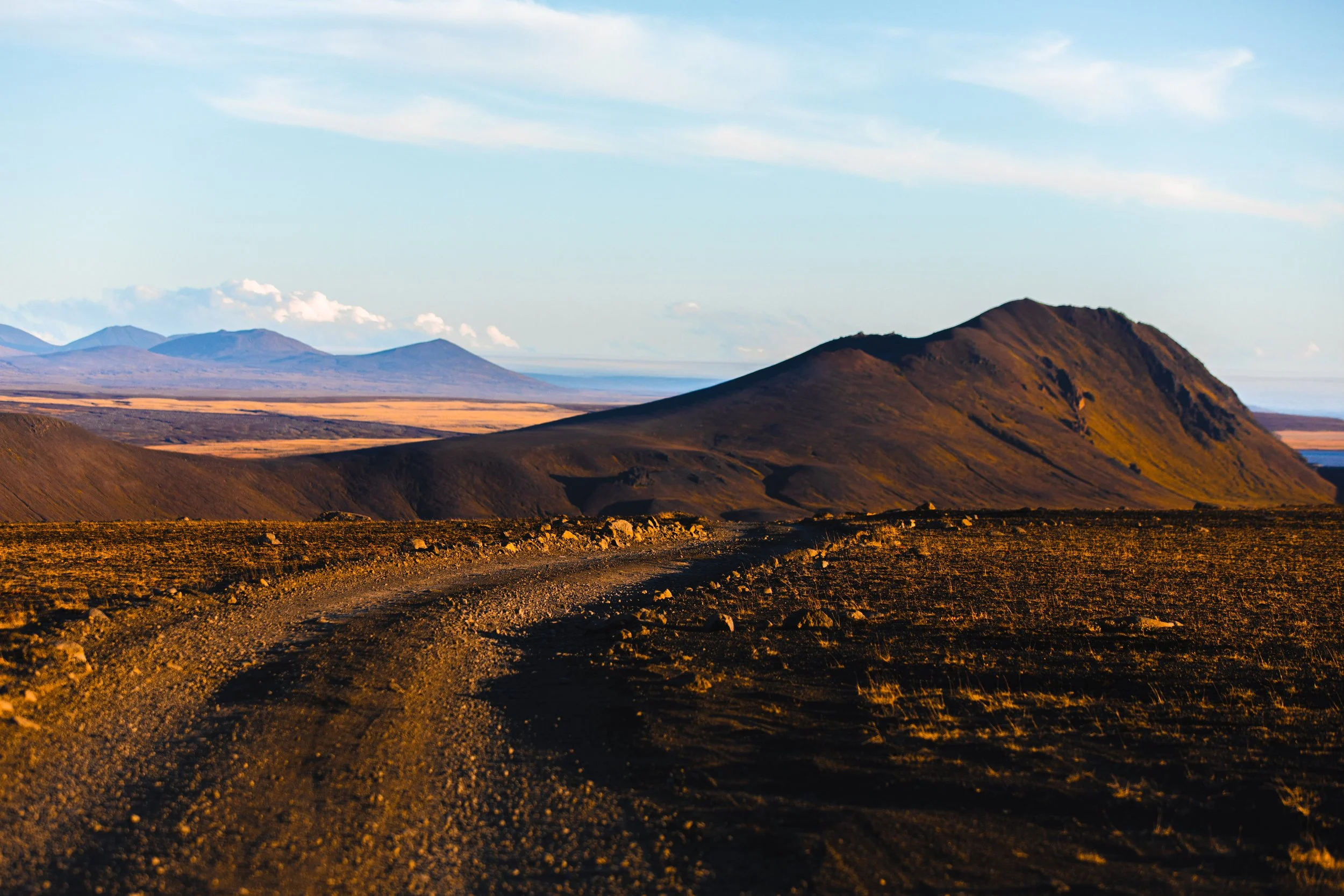 Gravel Road Through Icelandic Volcanic Landscape