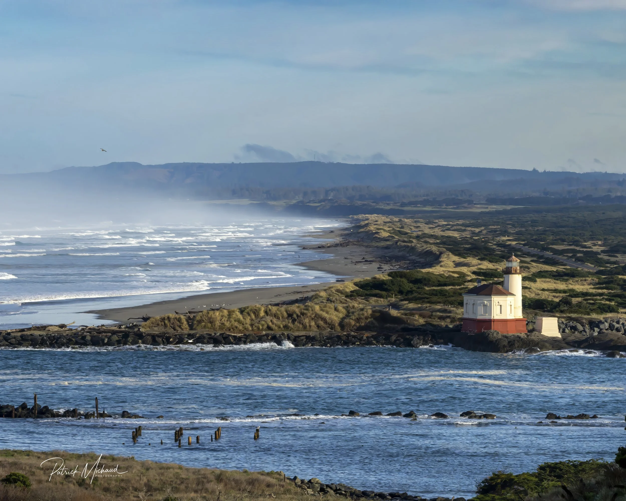 Coquille River Lighthouse and Bullards Beach in the background 