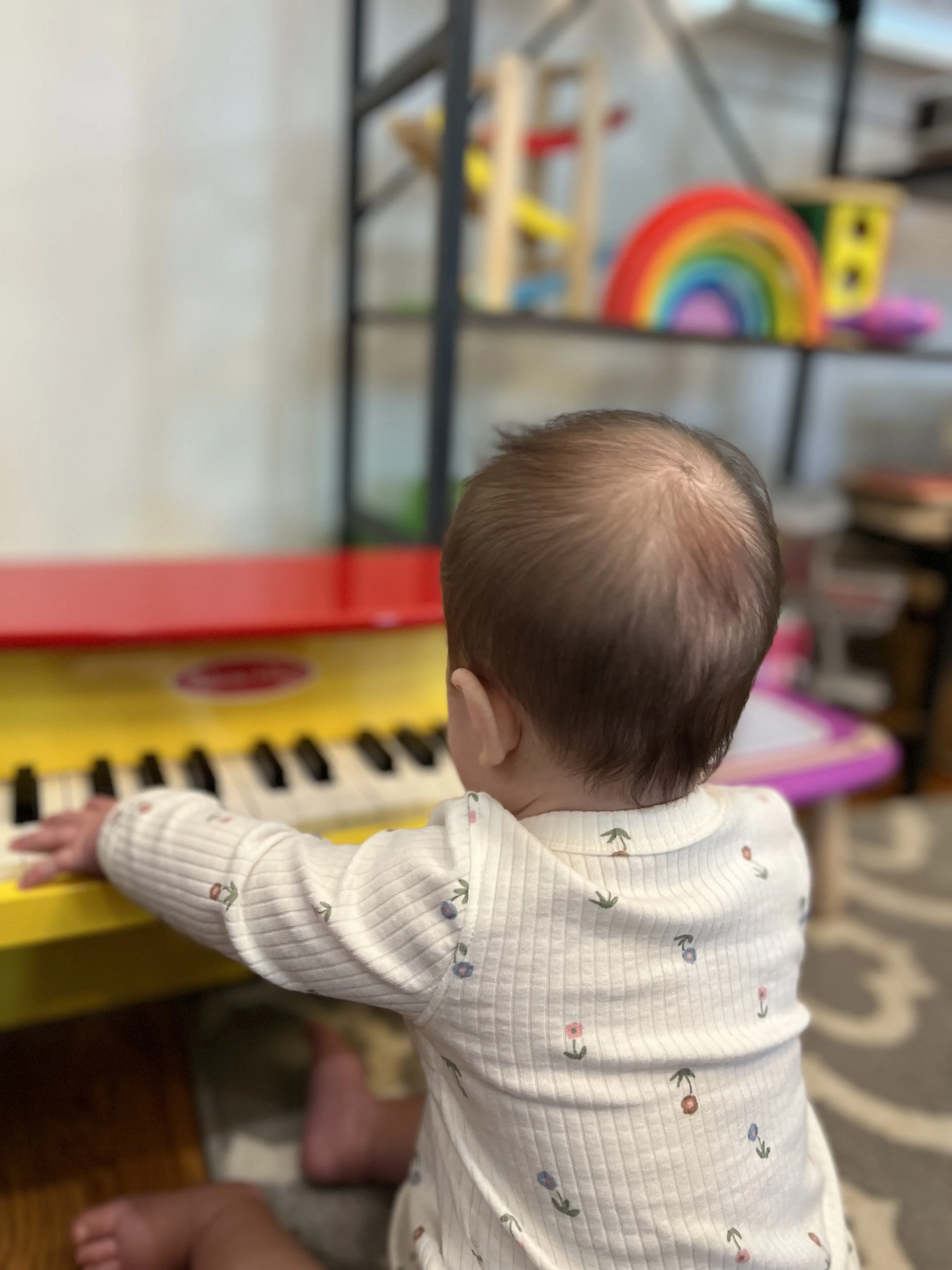 Baby playing a piano