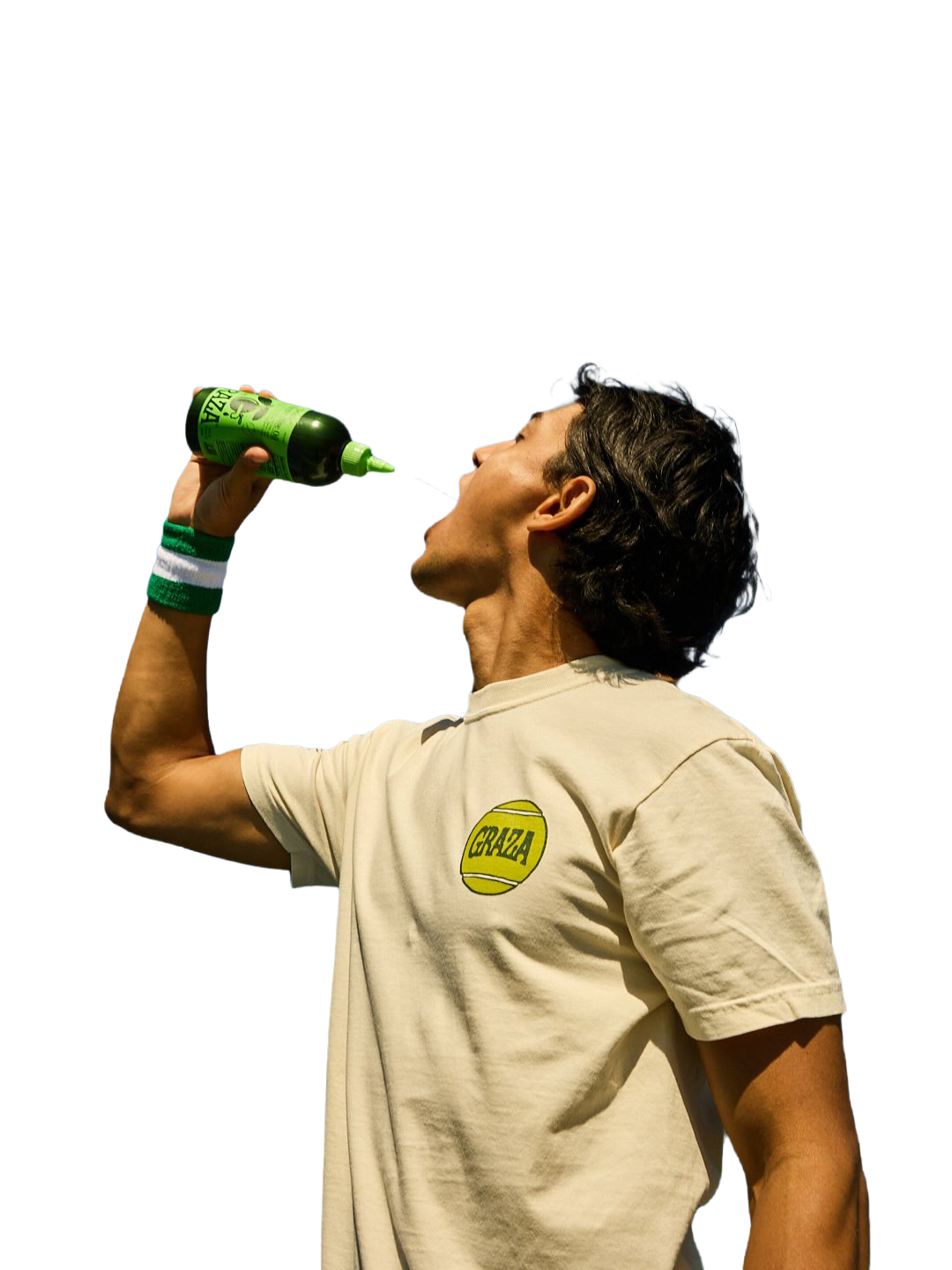 Man with dark hair wearing a beige t-shirt with a yellow logo drinks water from a green bottle against a white background.