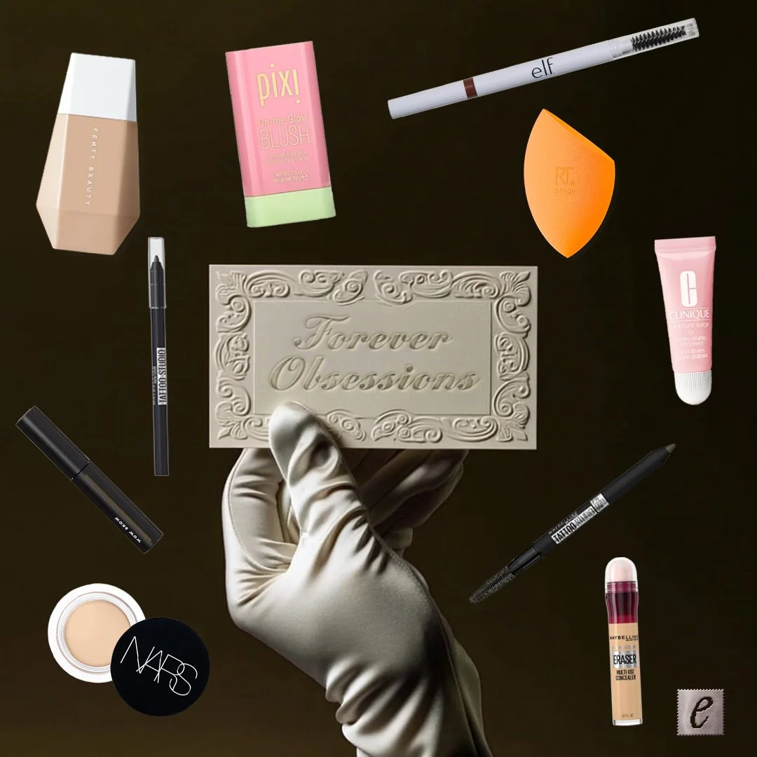 A hand in a satin glove holding a decorative card labeled "Forever Obsessions" with makeup products and tools scattered around, including foundations, blush, eyeliner, eyebrow pencil, concealer, lip balm, and a makeup sponge.