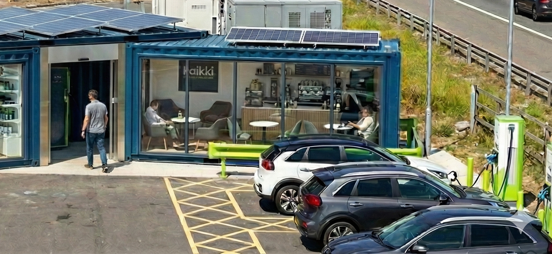 Kaikki roadside EV charging station, coffee lounge and store built from solar-powered containers, with EV chargers beside a UK motorway.