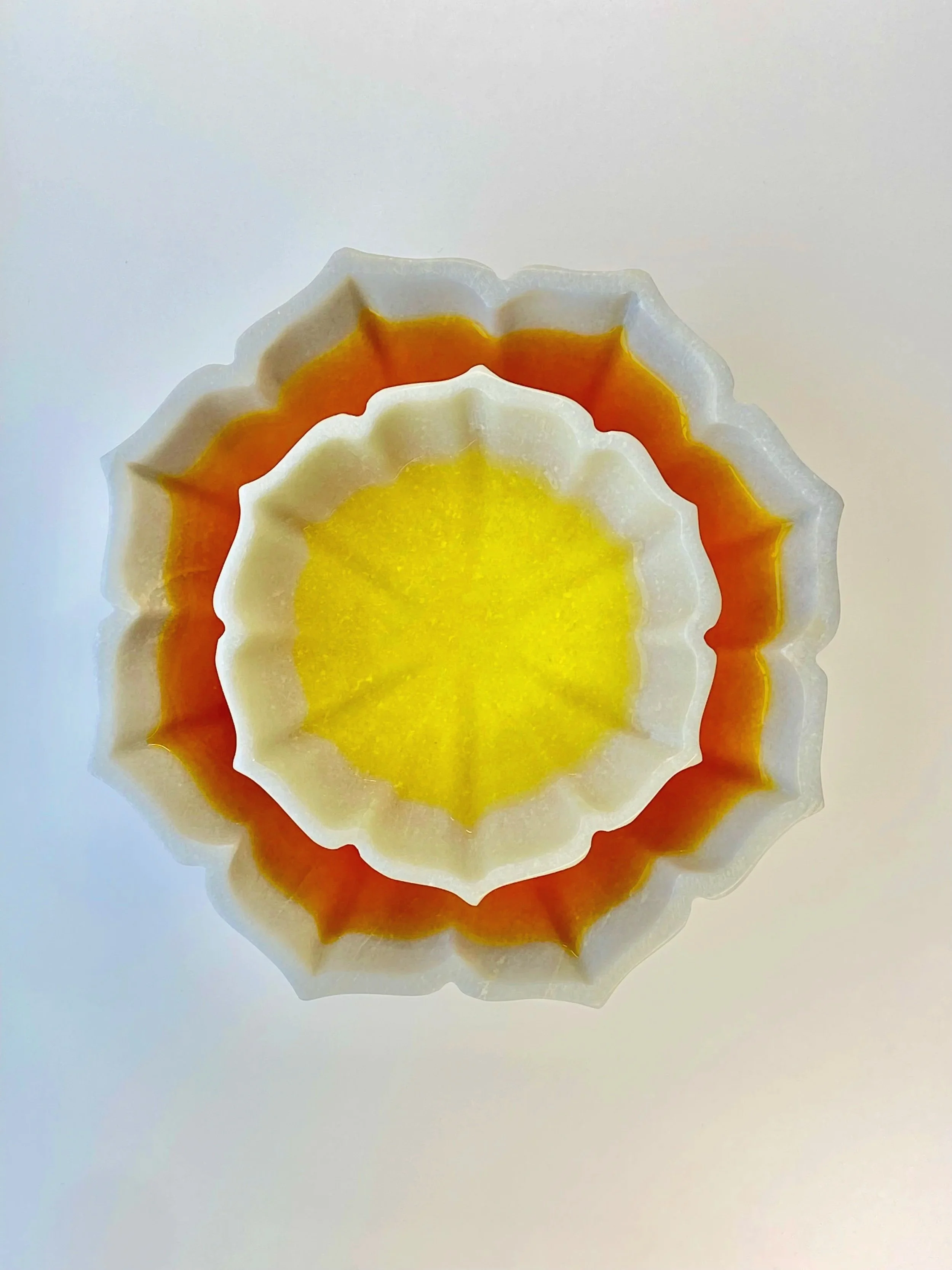 Saffron infusion in ceramic bowls for Golden Flower facial treatment at The Red Door Studio