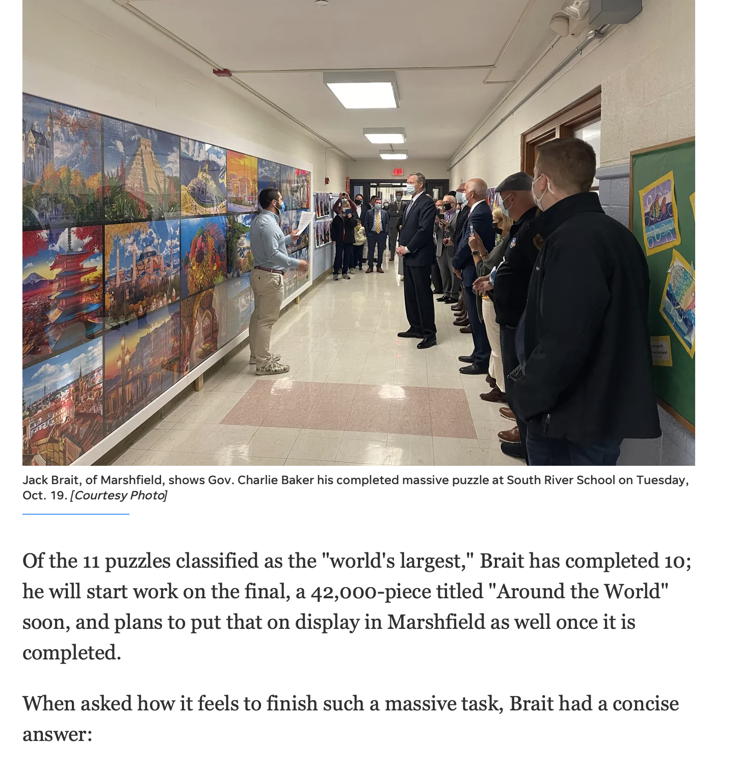 Jack Brait, aka Jack Of Puzzles, with former MA governor Charlie Baker at South River School in Marshfield, MA for the 51,300 piece puzzle on Coastal Mariner article C