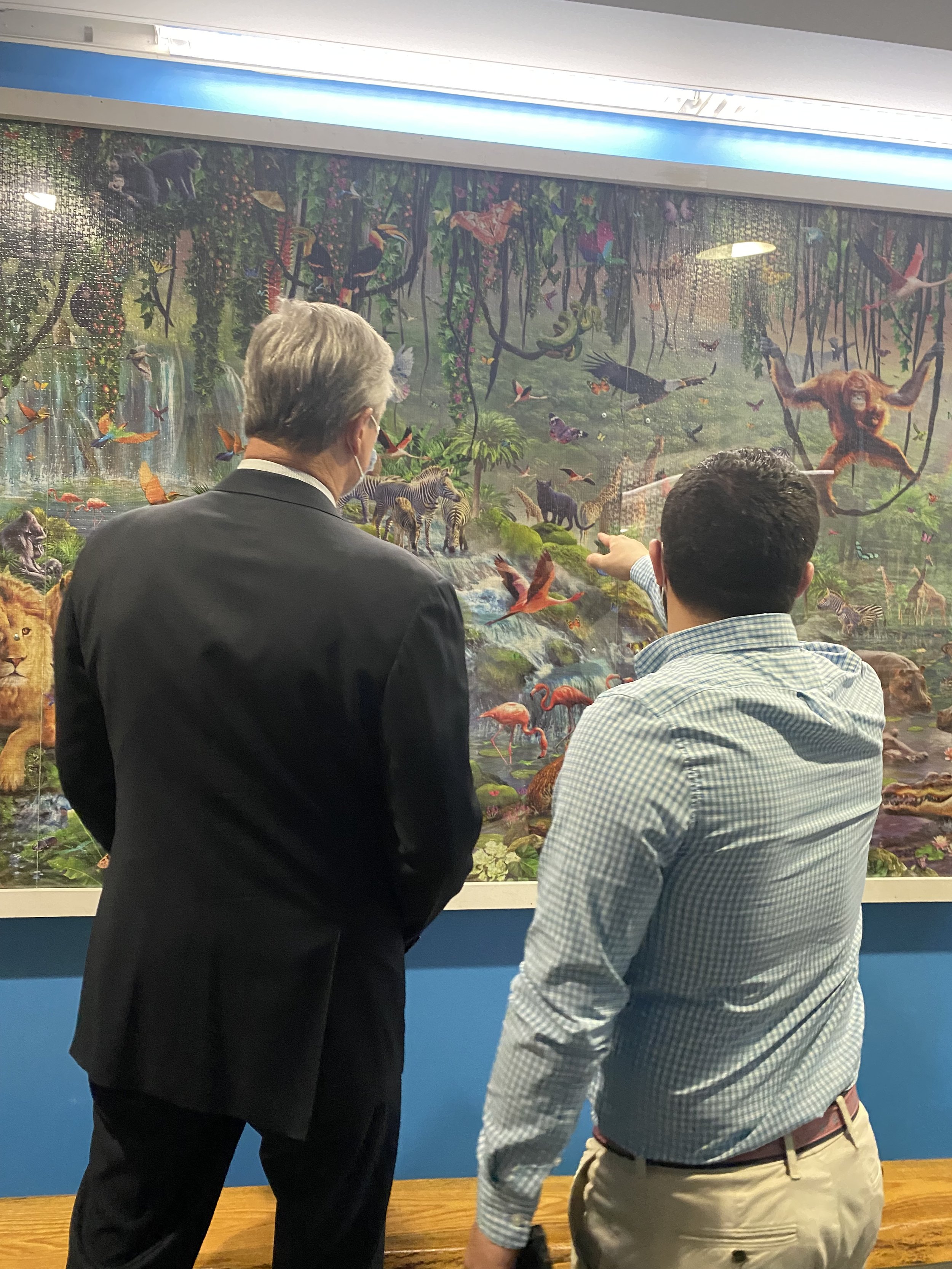 Jack Brait, aka Jack Of Puzzles, showing former Massachusetts Governor Charlie Baker the 33,600 piece puzzle world's largest puzzle by Educa Borras at the Boys and Girls Club of Marshfield, MA
