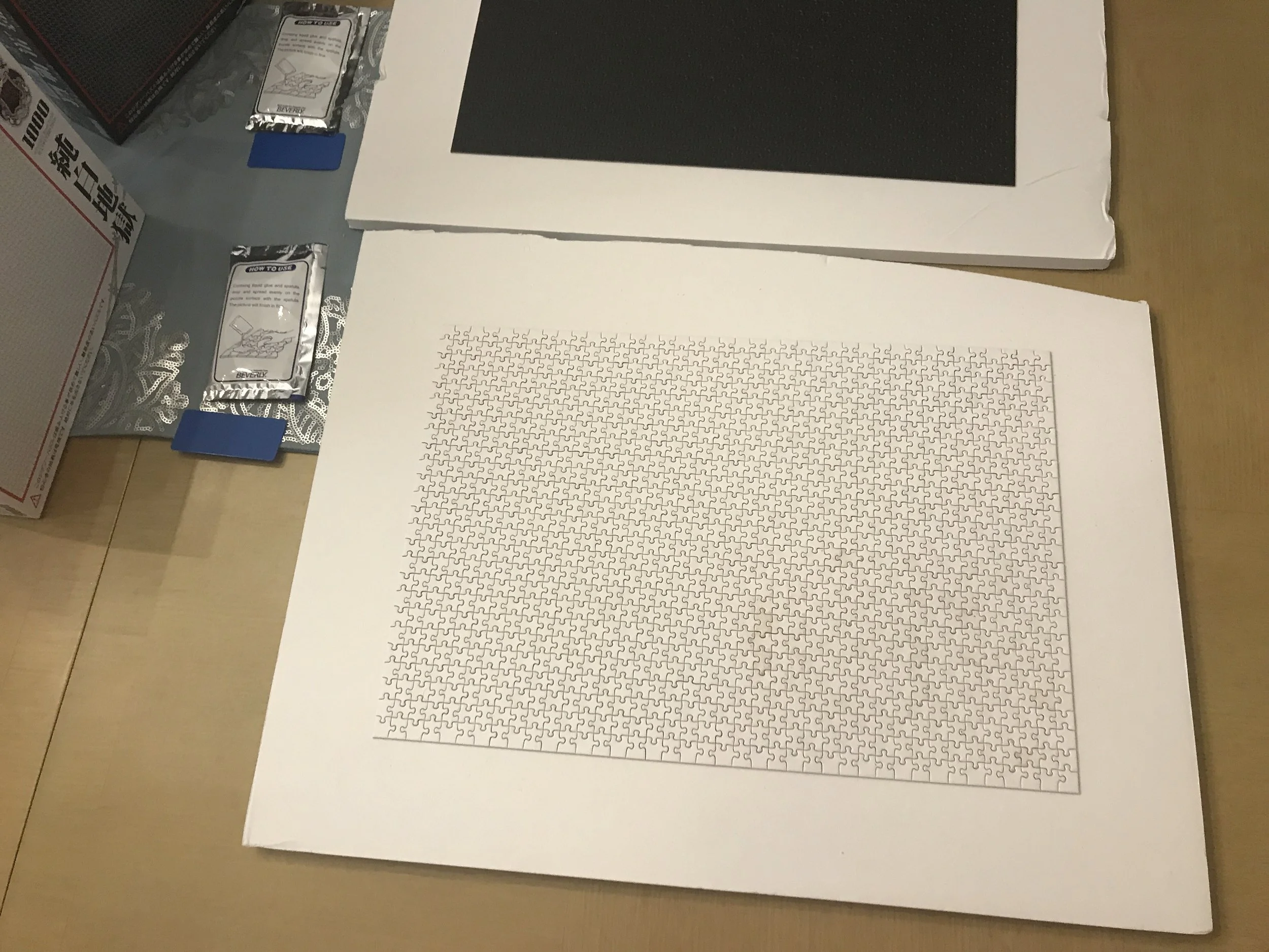 Jack Brait, aka Jack Of Puzzles, an all-white puzzle containing 1,000 tiny pieces.