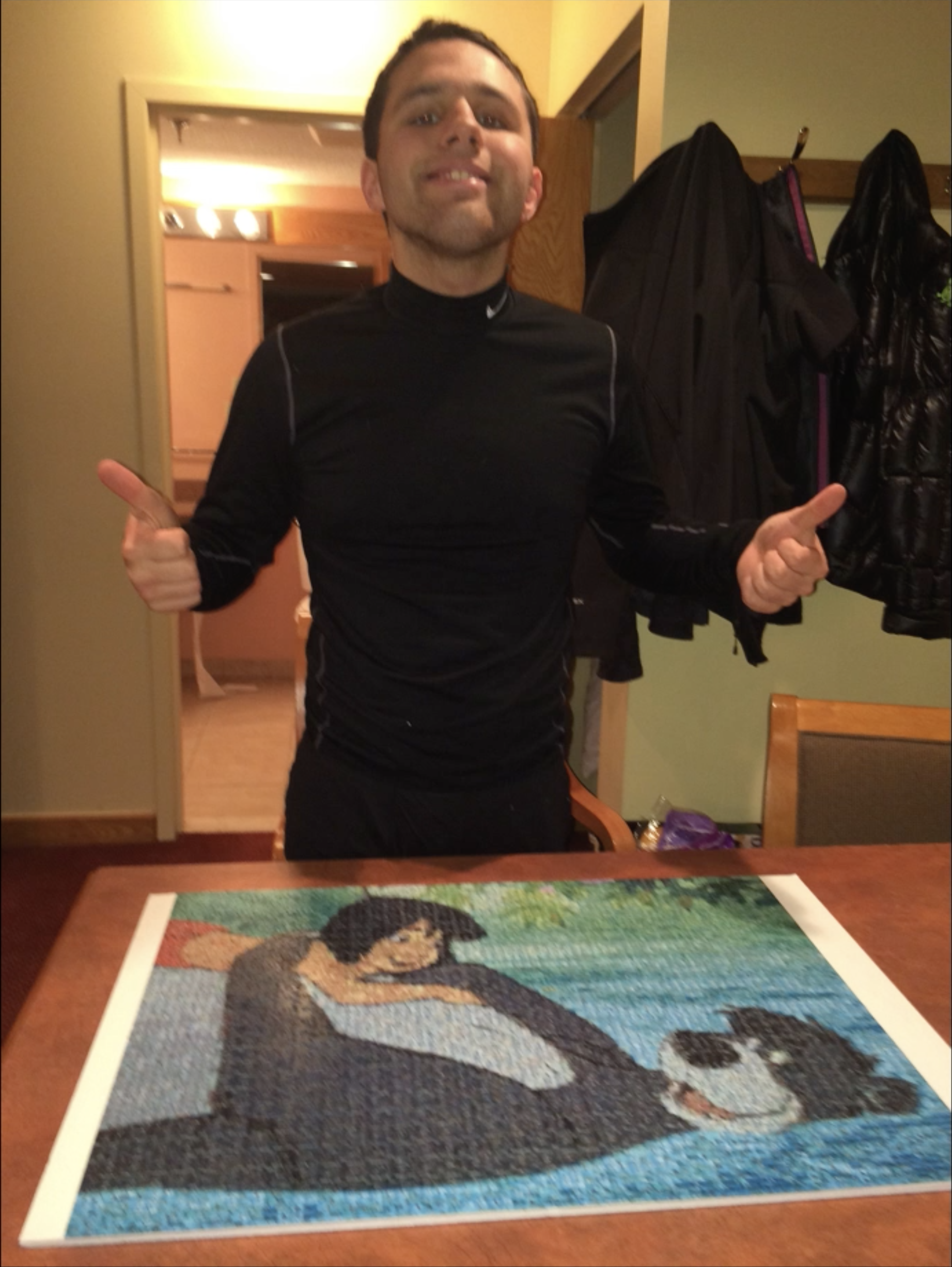 Jack Brait, aka Jack Of Puzzles, and his 1,000 piece photomosaic puzzle of Mowgli and Baloo from the Jungle Book