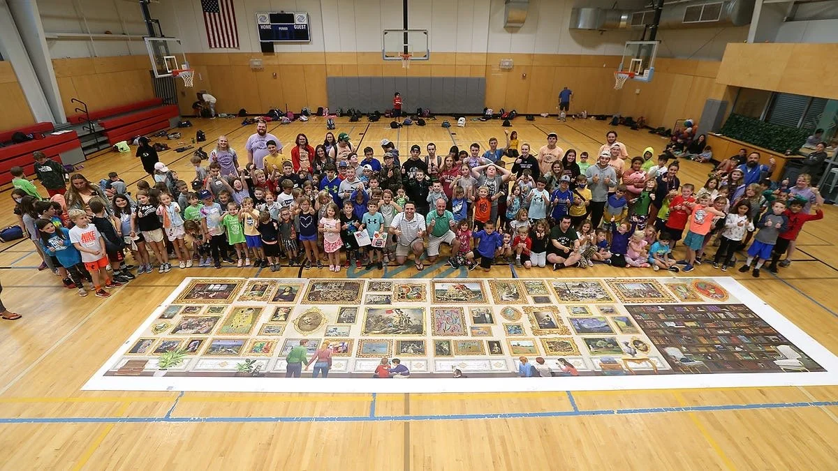 Jack Brait, aka Jack Of Puzzles, with all the kid campers and counselors at the Boys and Girls Club of Marshfield, MA standing in front of the 54,000 piece puzzle by Grafika Puzzles