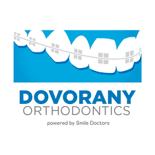 Logo for Dovorany Orthodontics with a stylized smile graphic and blue and white color scheme.