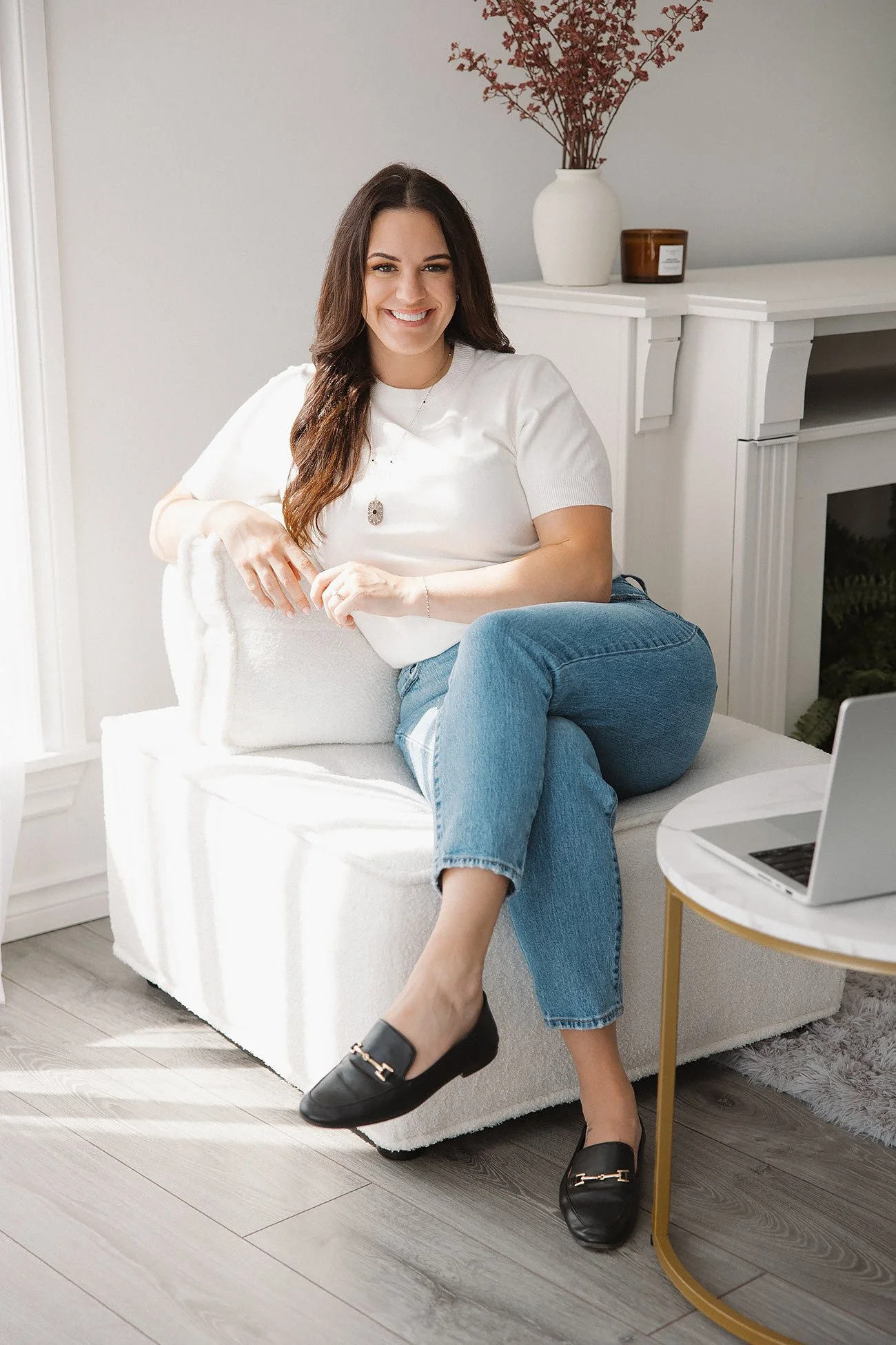 The founder of Carried With Love seated in a living room, representing leadership in independent surrogacy guidance.