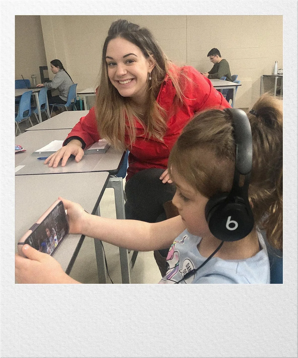 Ariel in a classroom interacting with children during her social work training.