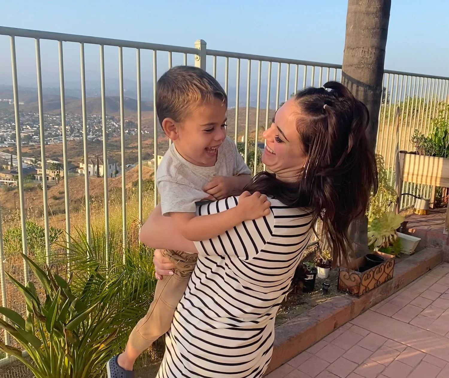 Ariel Taylor laughing with Mark and Kevin's son during a visit