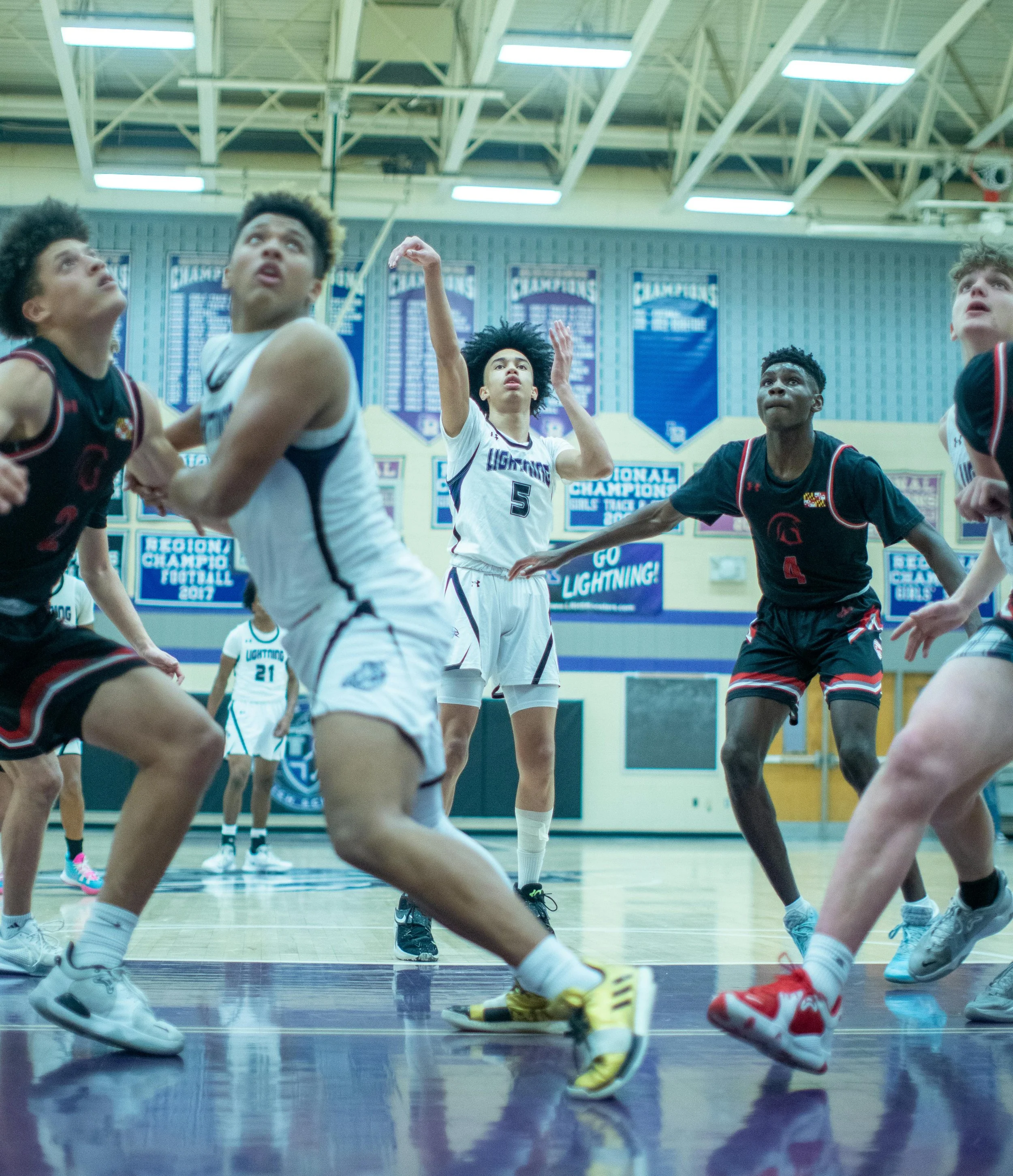Student athlete shooting a free throw in a basketball game.