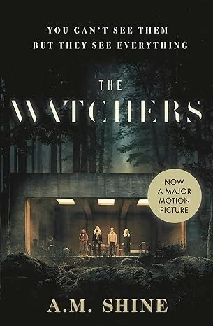 Book cover for 'The Watchers' by A.M. Shine, featuring a dark, forested scene with a bridge and four people standing underneath it. Text on cover reads 'You can't see them but they see everything' and a yellow sticker states 'Now a major motion picture.'