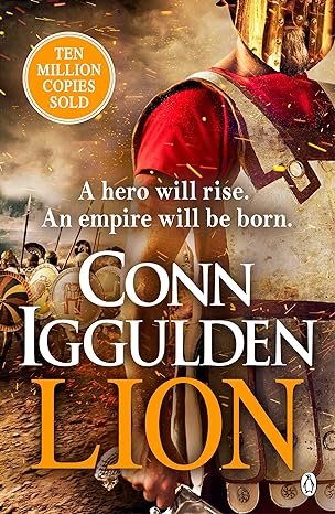 Cover of the book 'Conn Iggulden Lion' featuring a person wearing historical armor, with a background of a battlefield scene, and a badge indicating ten million copies sold.