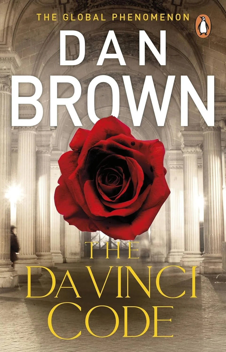 Book cover of 'The Da Vinci Code' by Dan Brown, featuring a large red rose in front of classical architecture with columns.