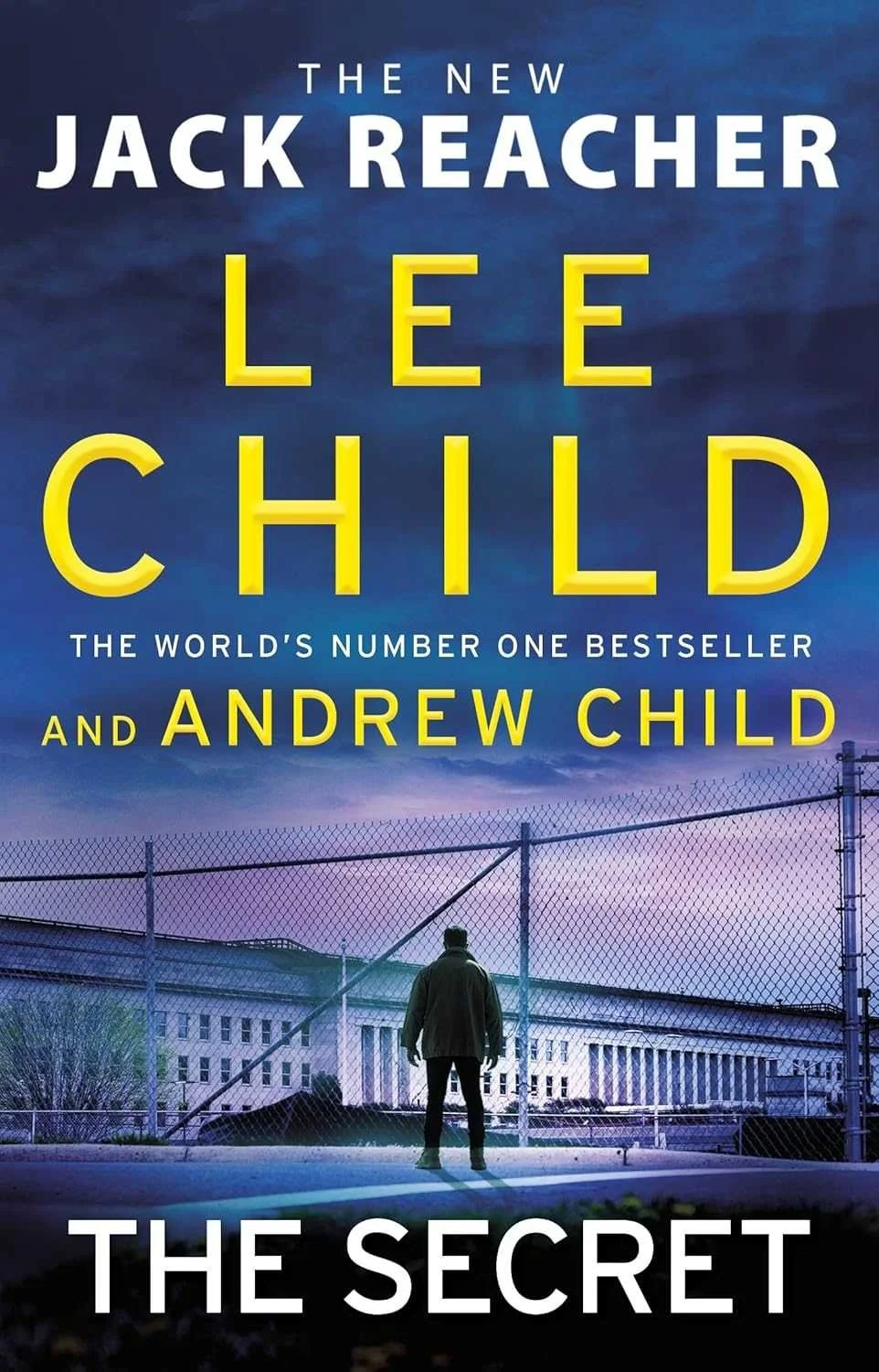 Cover of "The Secret" by Lee Child and Andrew Child featuring a man standing in front of a chain-link fence outside a large institutional building during sunset, with dark clouds overhead.