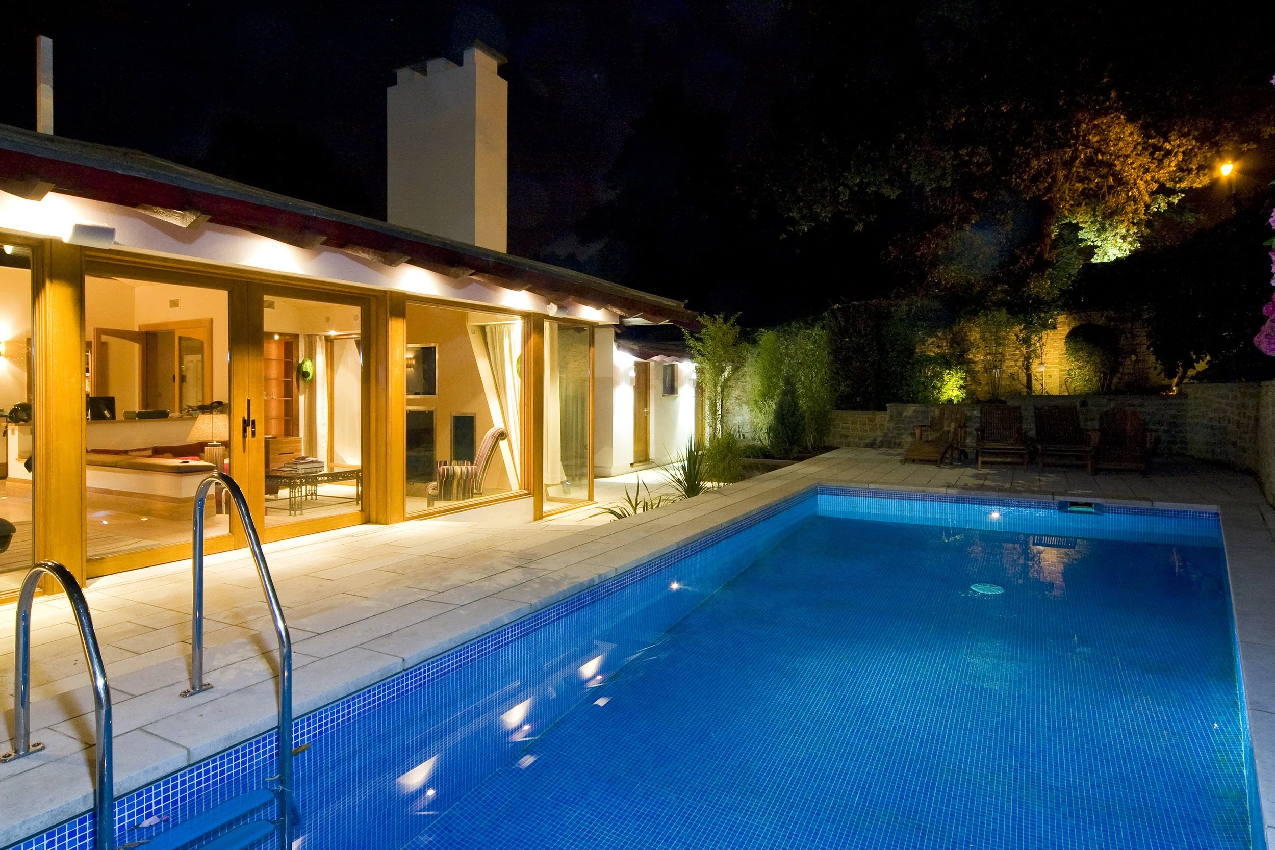 Outdoor pool and terrace at night.jpg