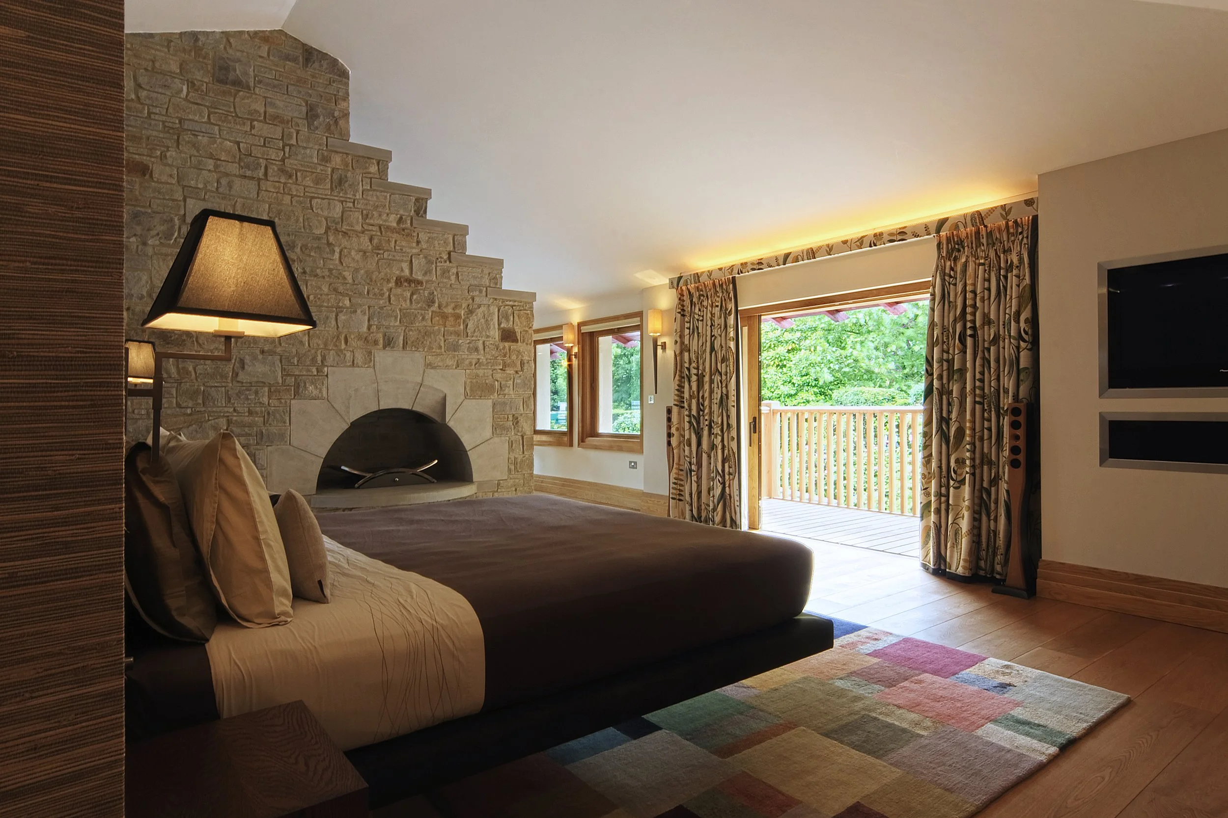 Master bedroom with stone fireplace.jpg