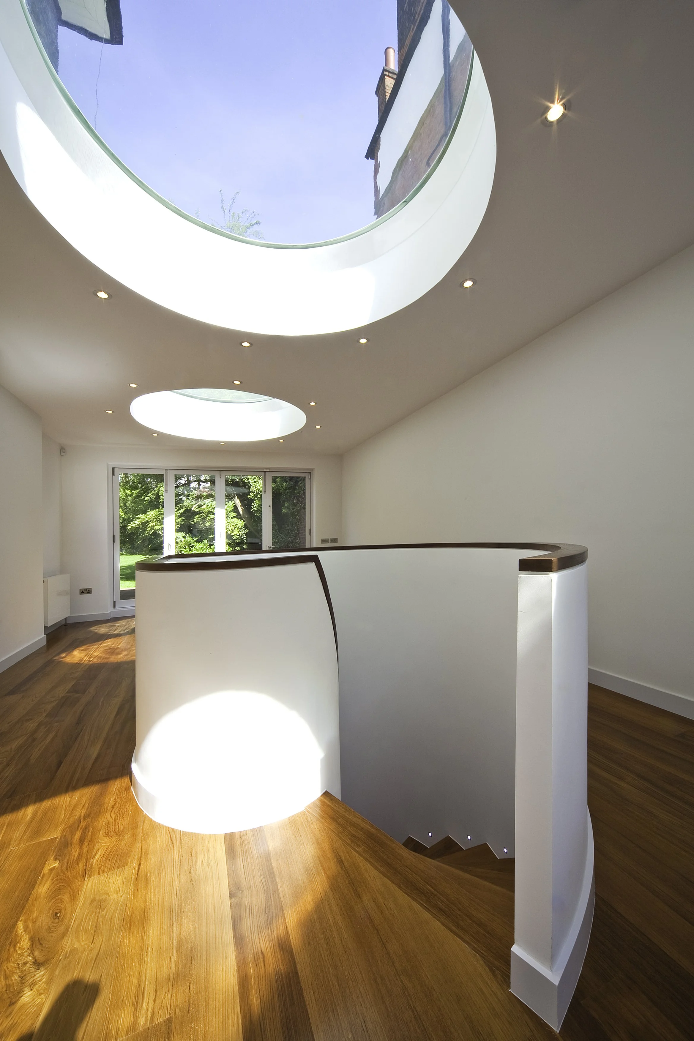 Circular roof light centred over new spiral stair