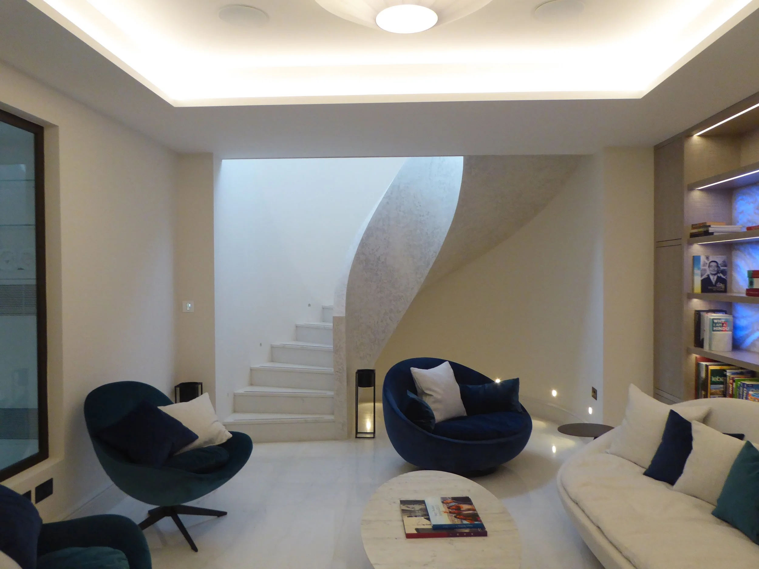 Basement bar area with cantilevered spiral stair