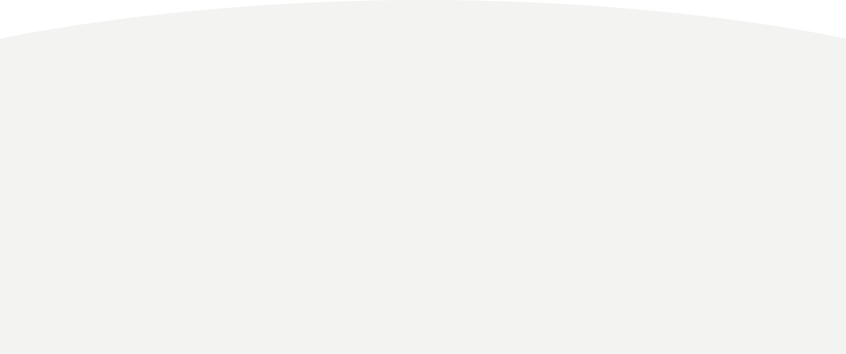 Close-up of a chocolate cookie with a bite taken out of it, showing the cookie's crunchy texture.