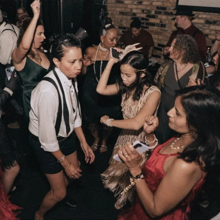 Two guests dancing at a birthday celebration.